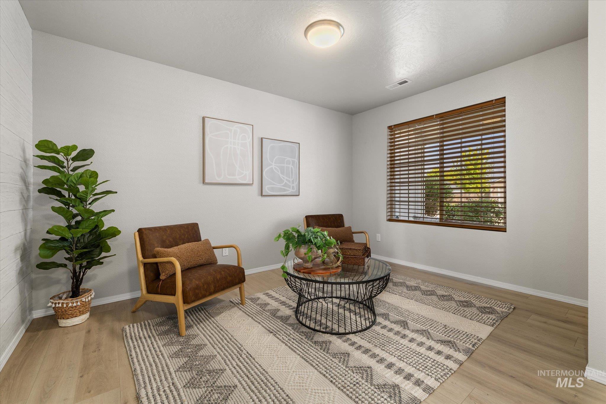 Living area featuring light wood-style floors