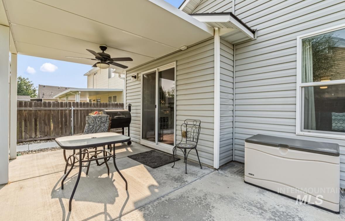 View of patio / terrace featuring a ceiling fan and a grill