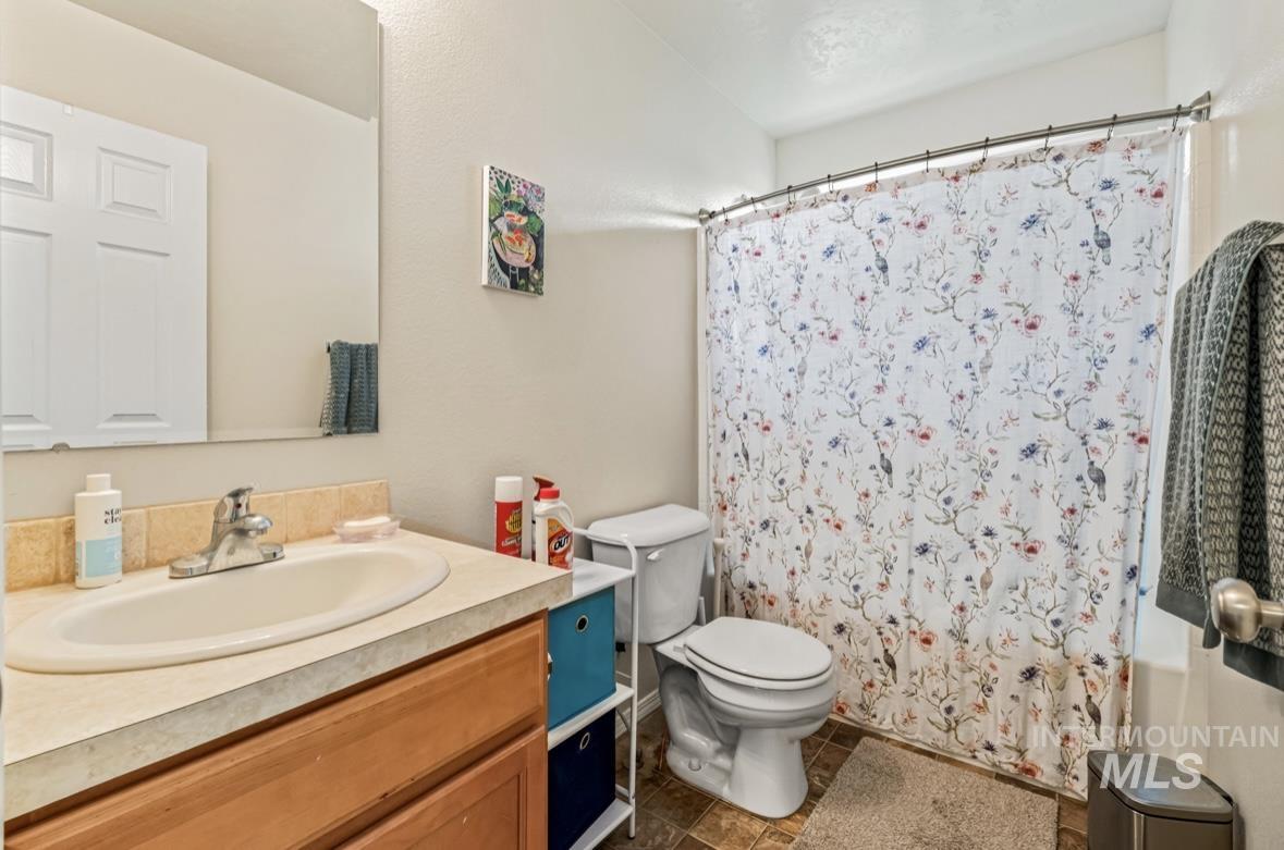 Full bathroom featuring vanity and shower / tub combo