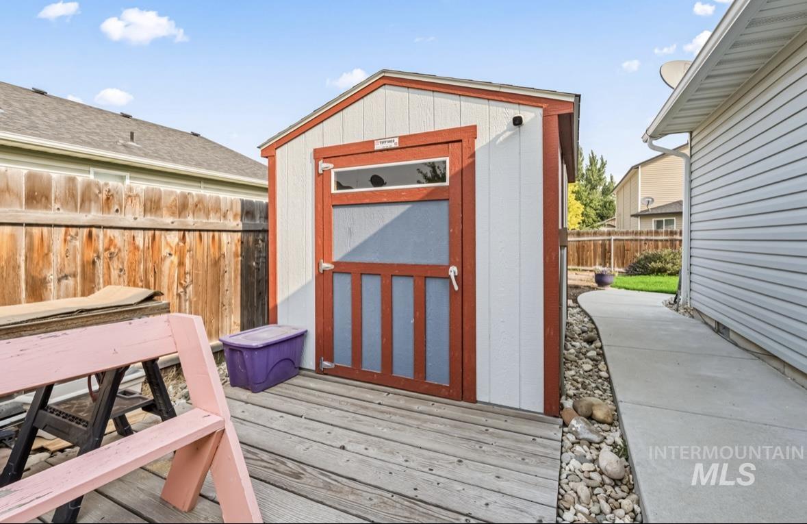 View of shed featuring a fenced backyard