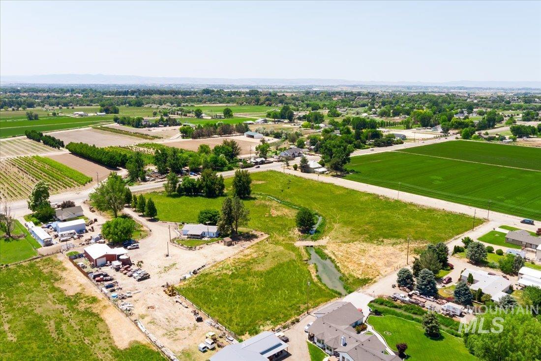 Aerial view of sparsely populated area featuring abundant farmland