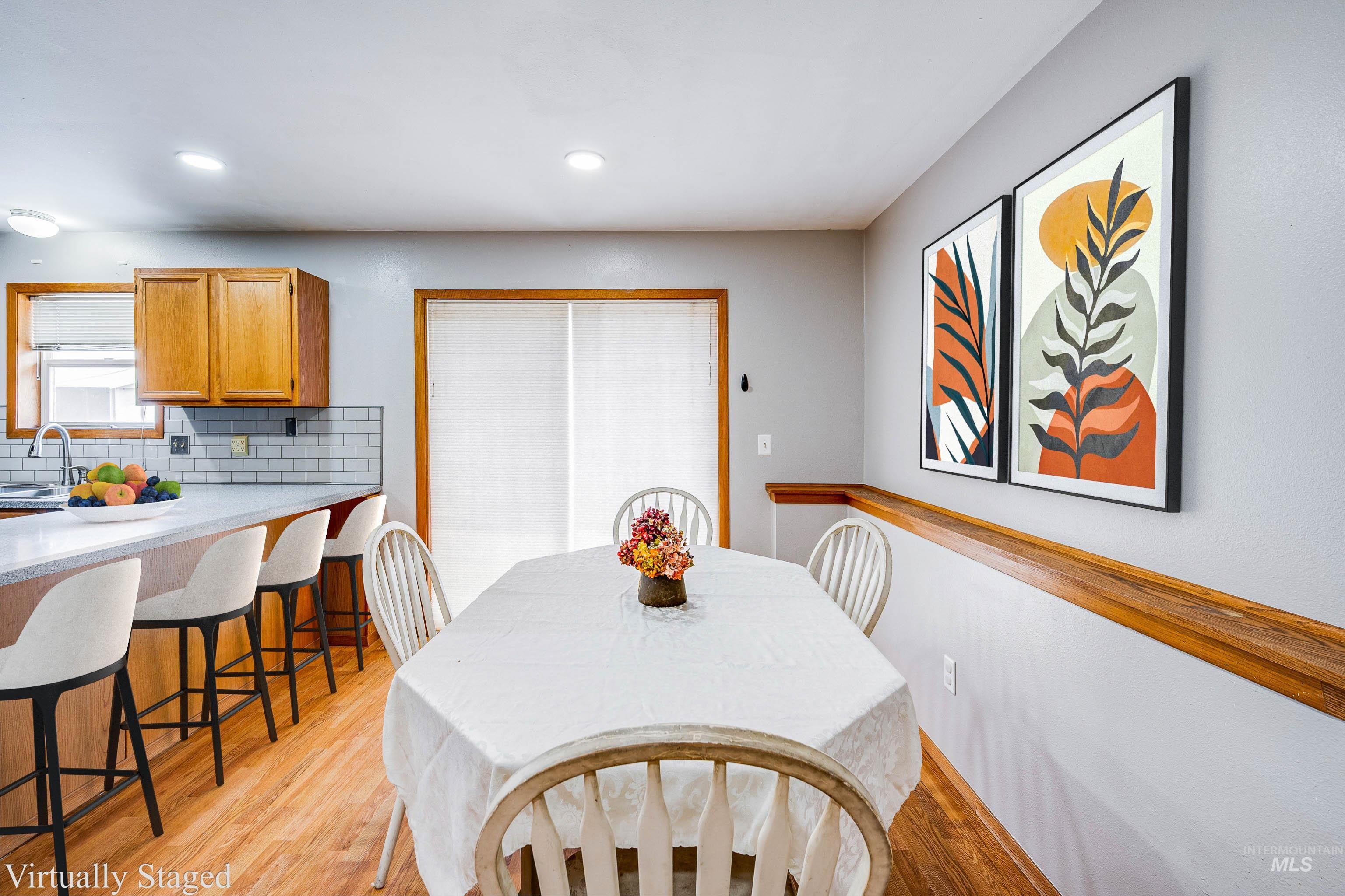 Dining room featuring light wood-style floors and recessed lighting