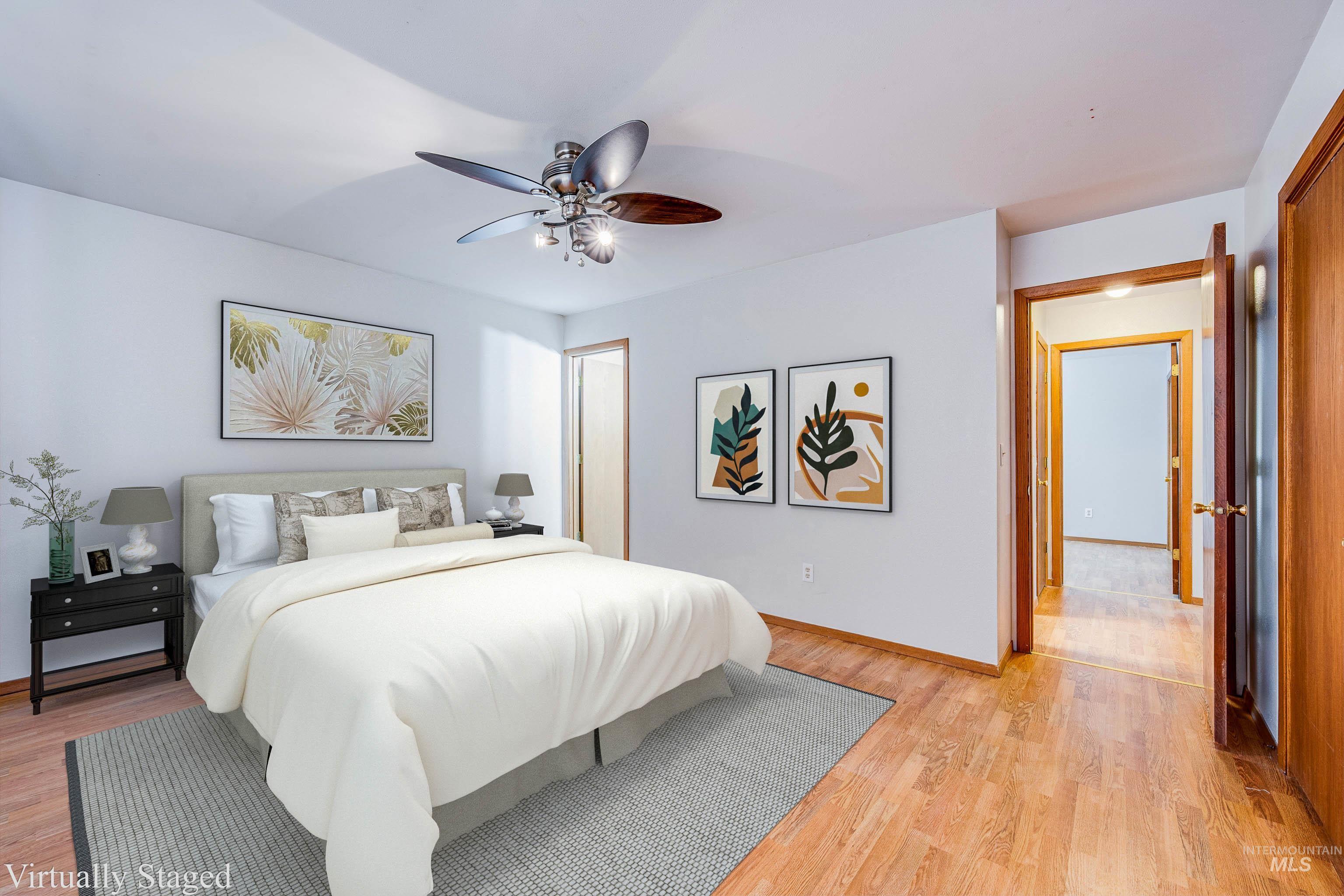 Bedroom with light wood-type flooring and ceiling fan
