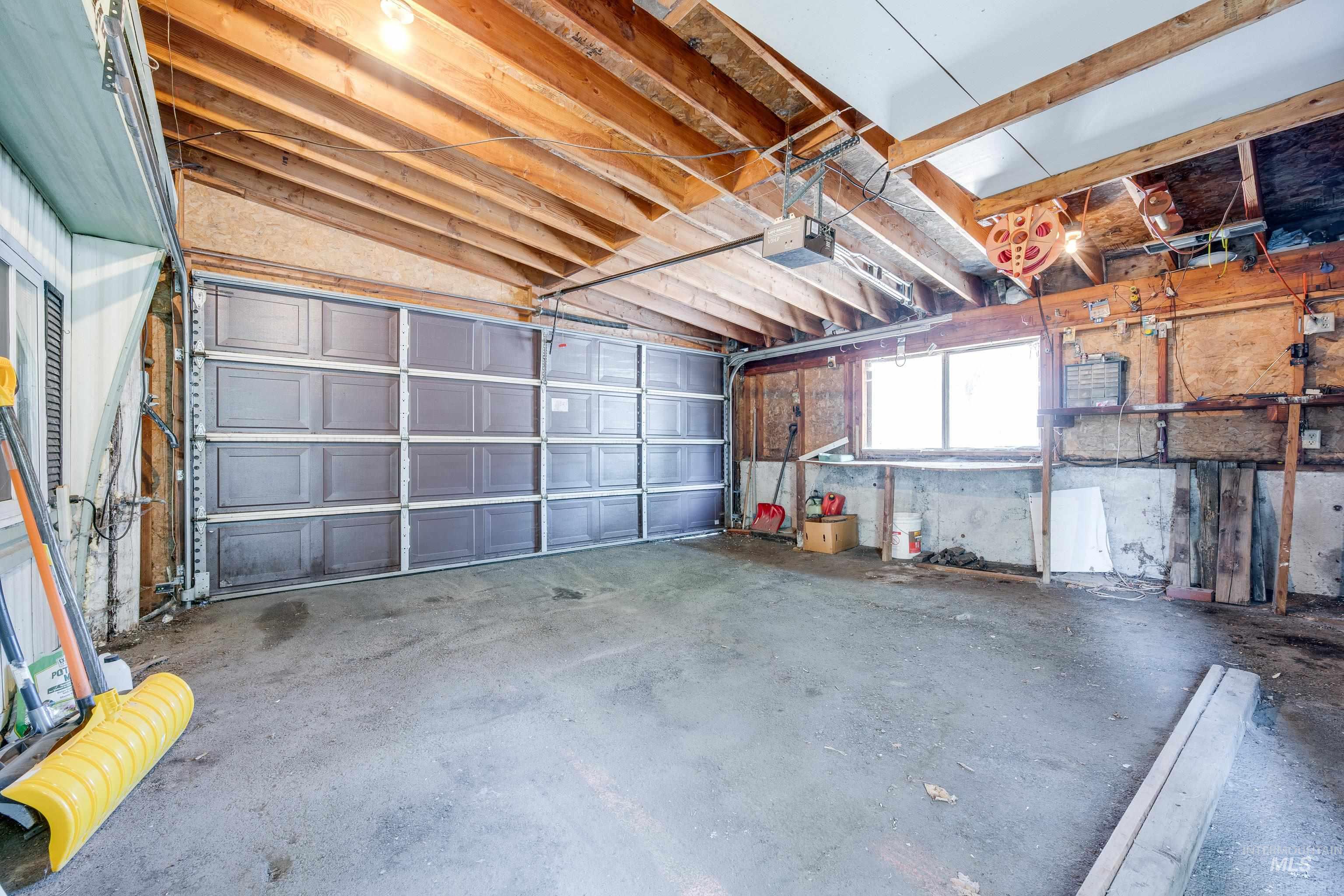 Garage featuring a garage door opener