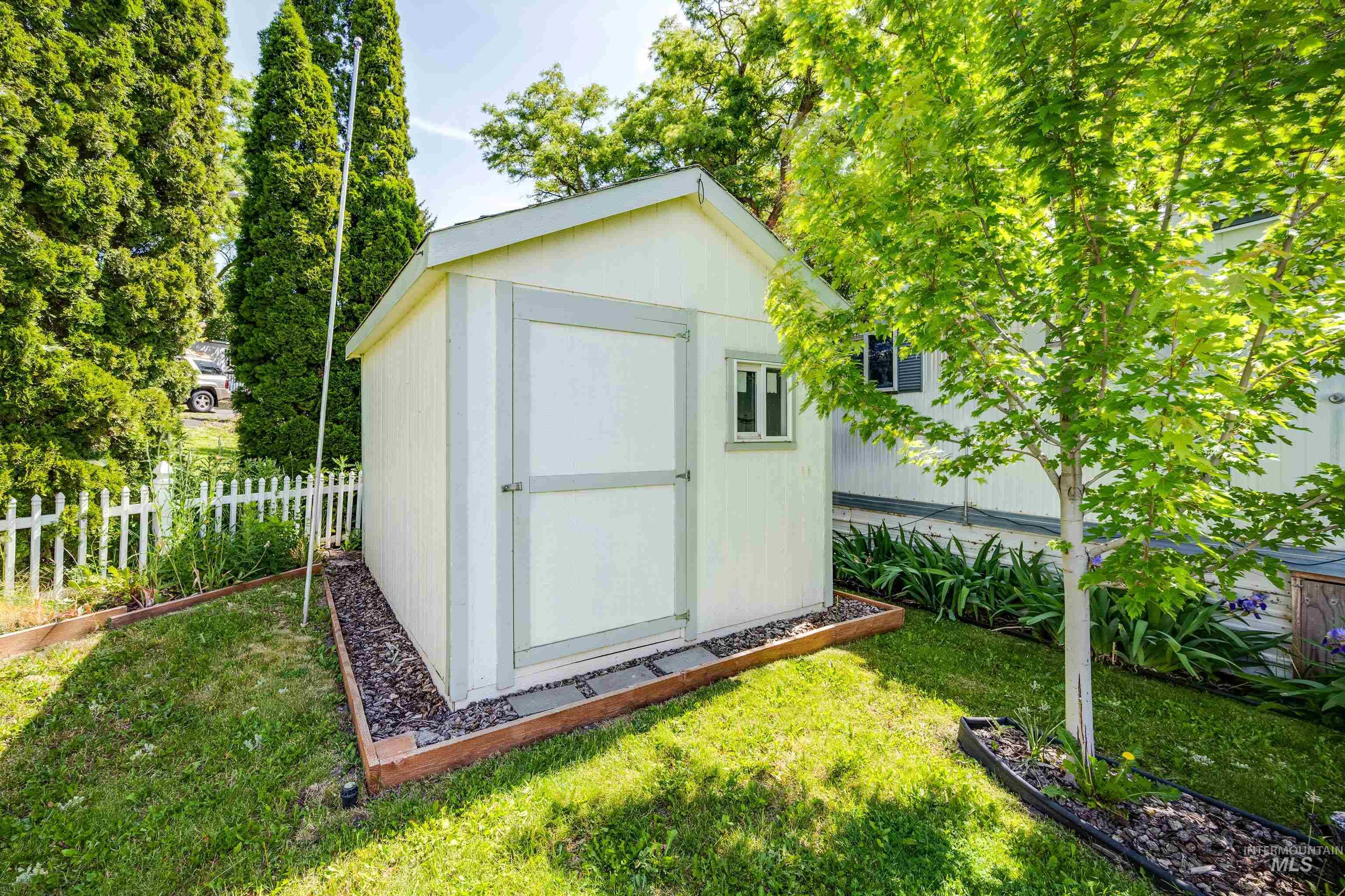 View of shed with a garden
