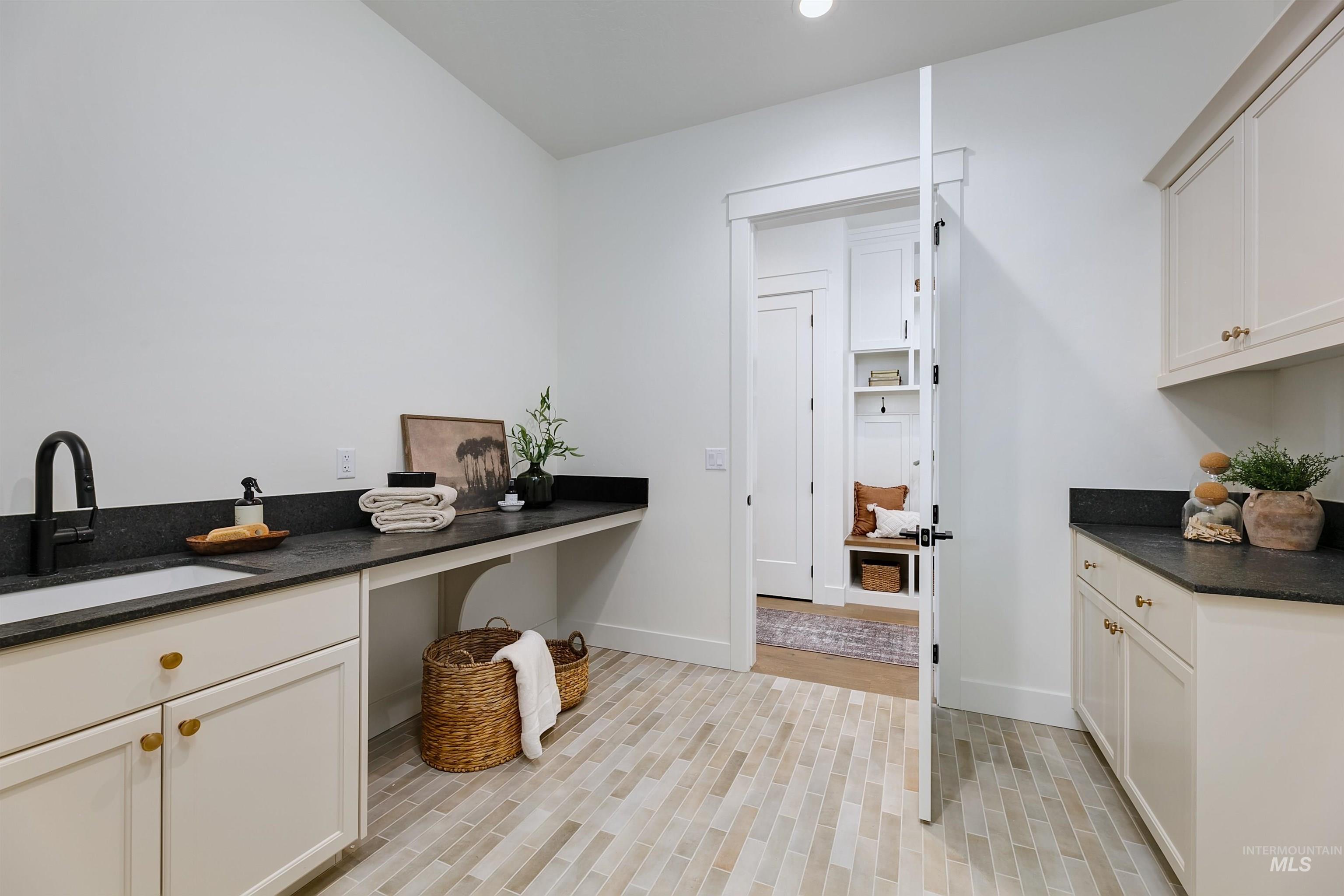 Washroom with a sink and recessed lighting