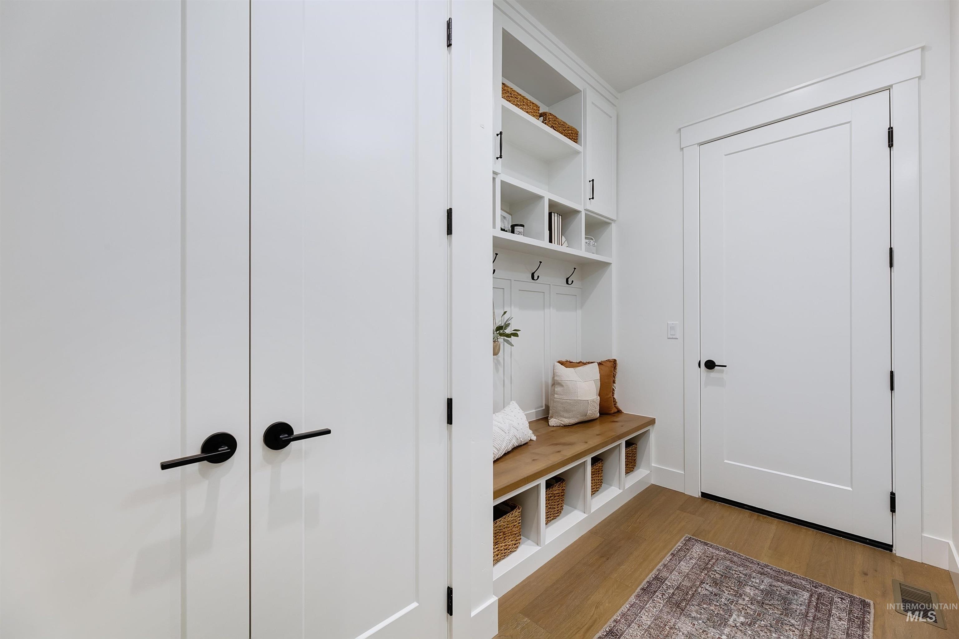 Mudroom with light wood-style floors