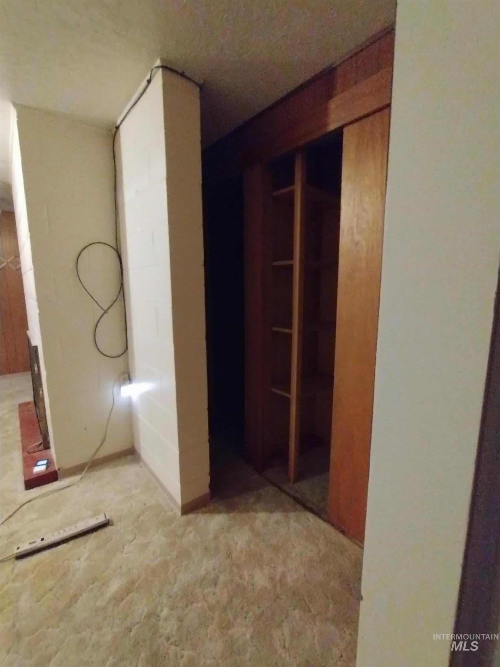 Behind fire place downstairs