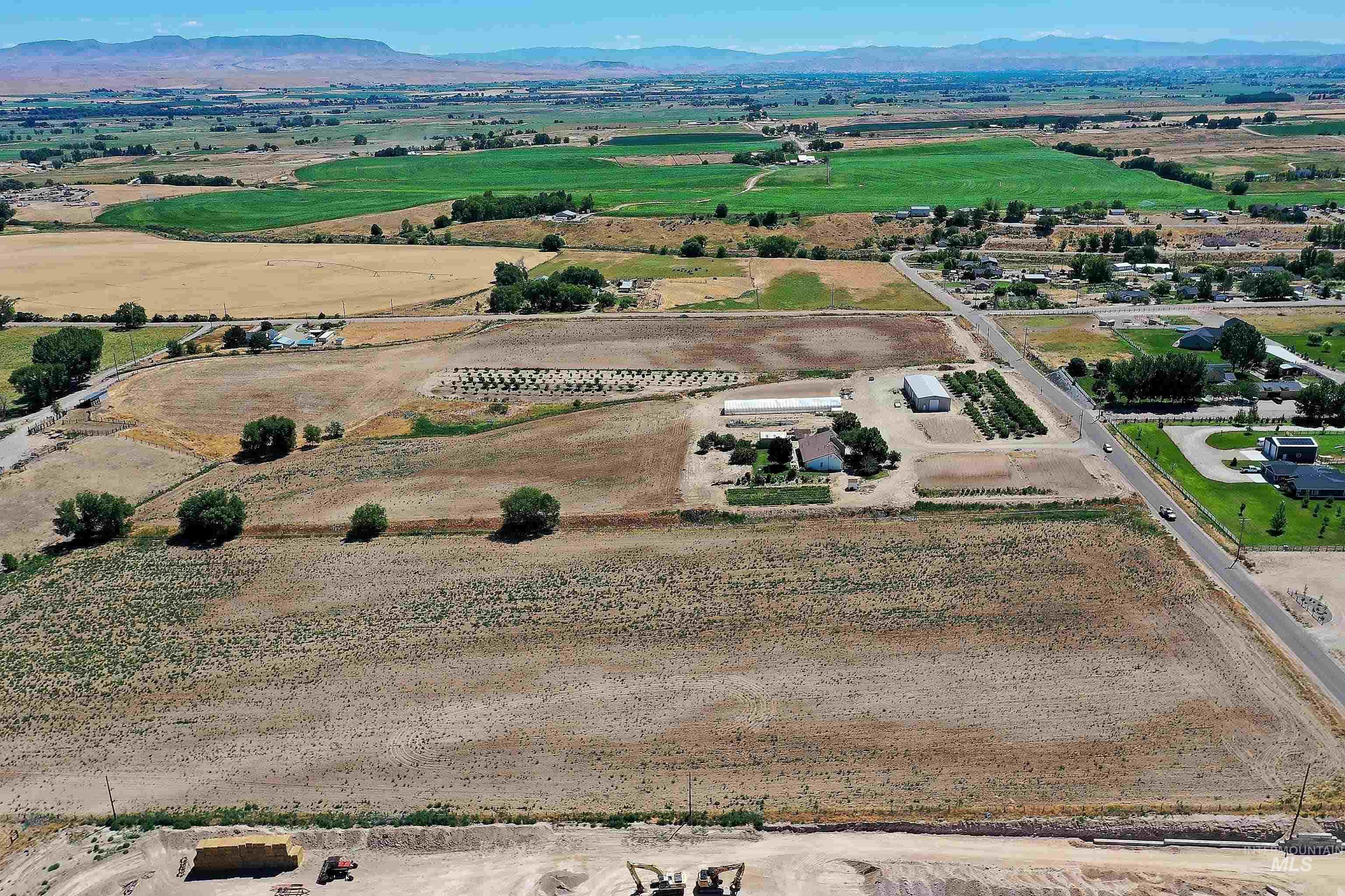 Aerial view of sparsely populated area featuring a mountainous background