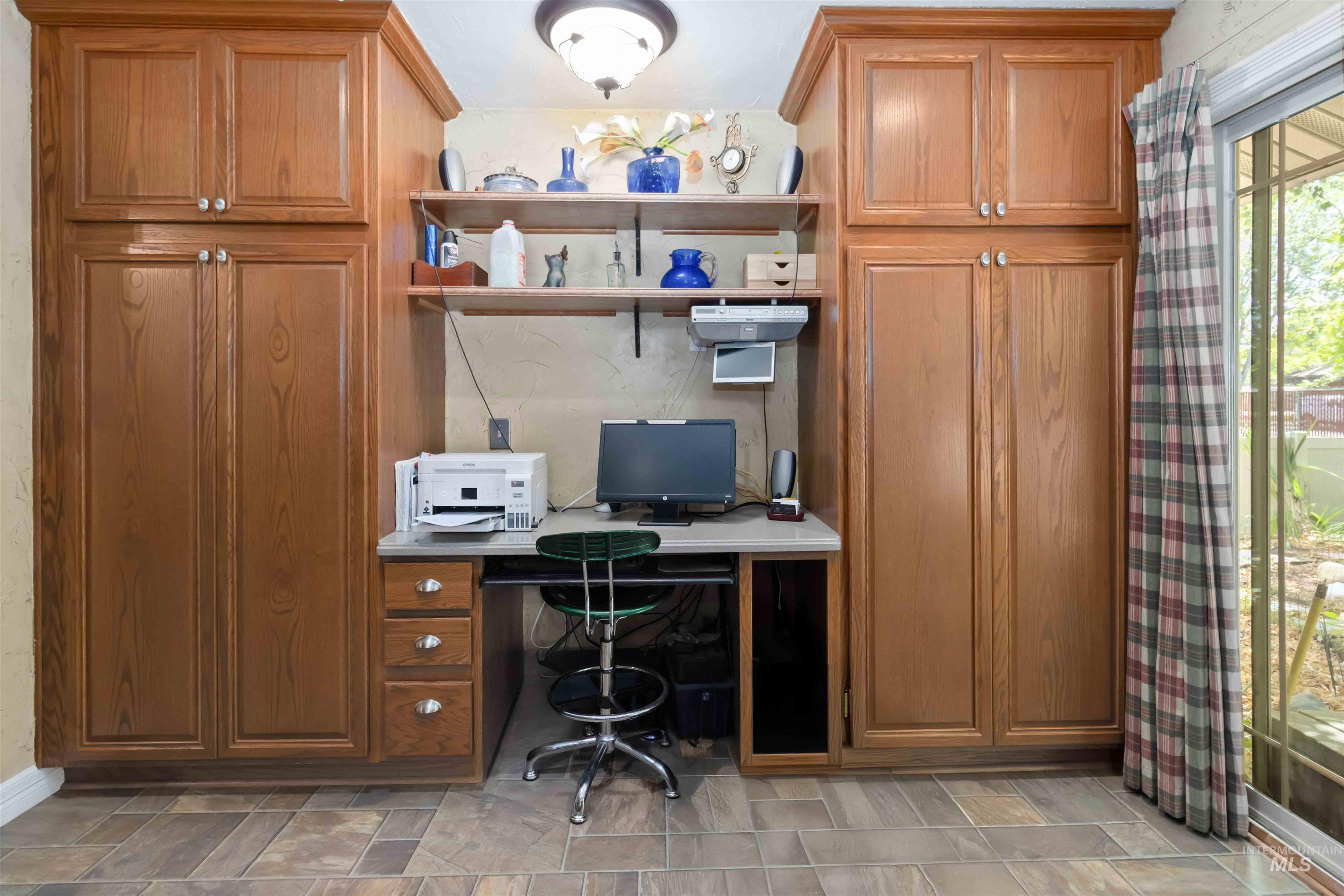 Office featuring built in desk