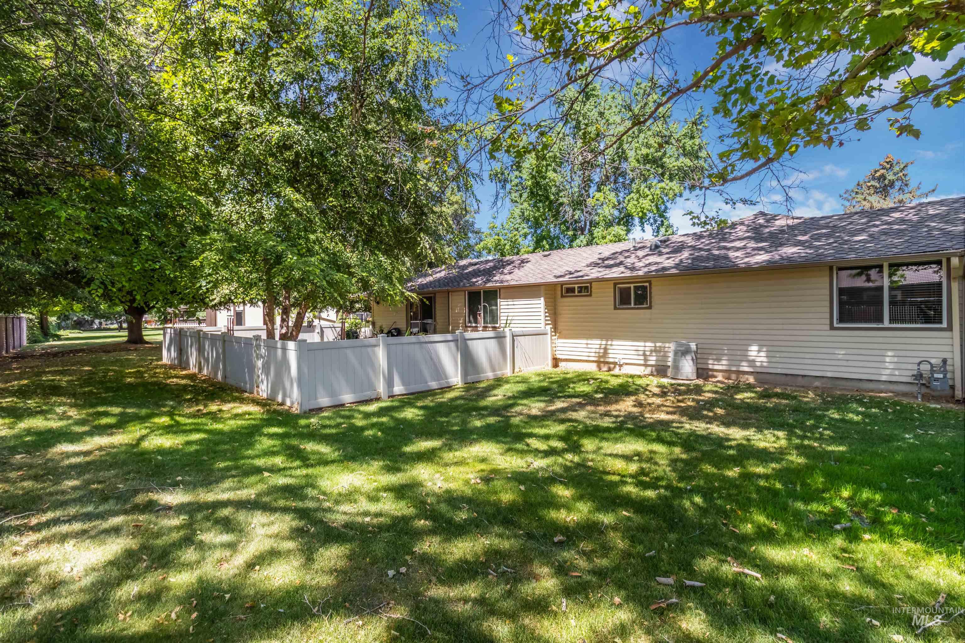 Backyard with a section fully fenced wit newer vinyl fencing.  No backyard neighbors.