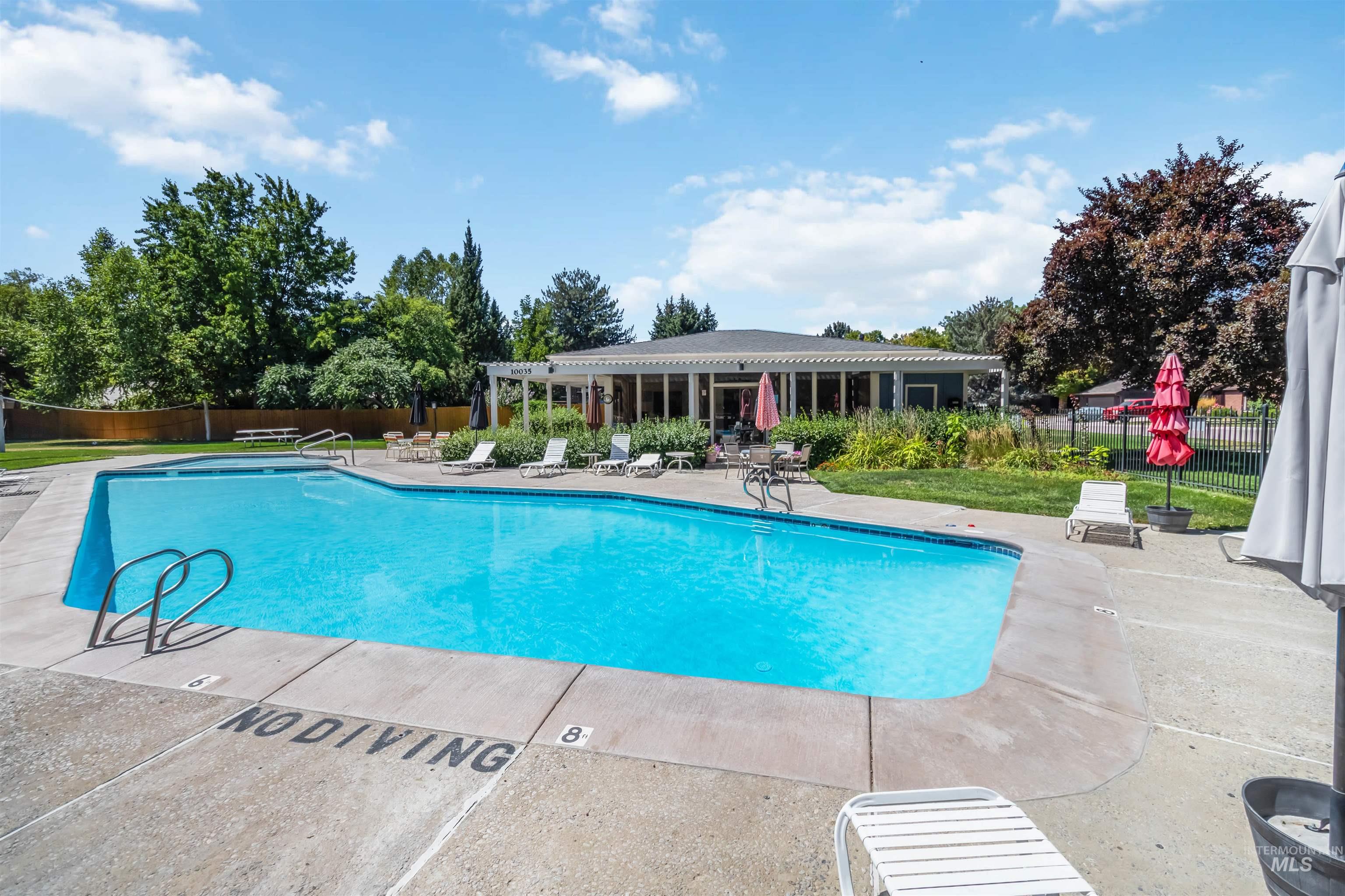 Community pool featuring a patio area