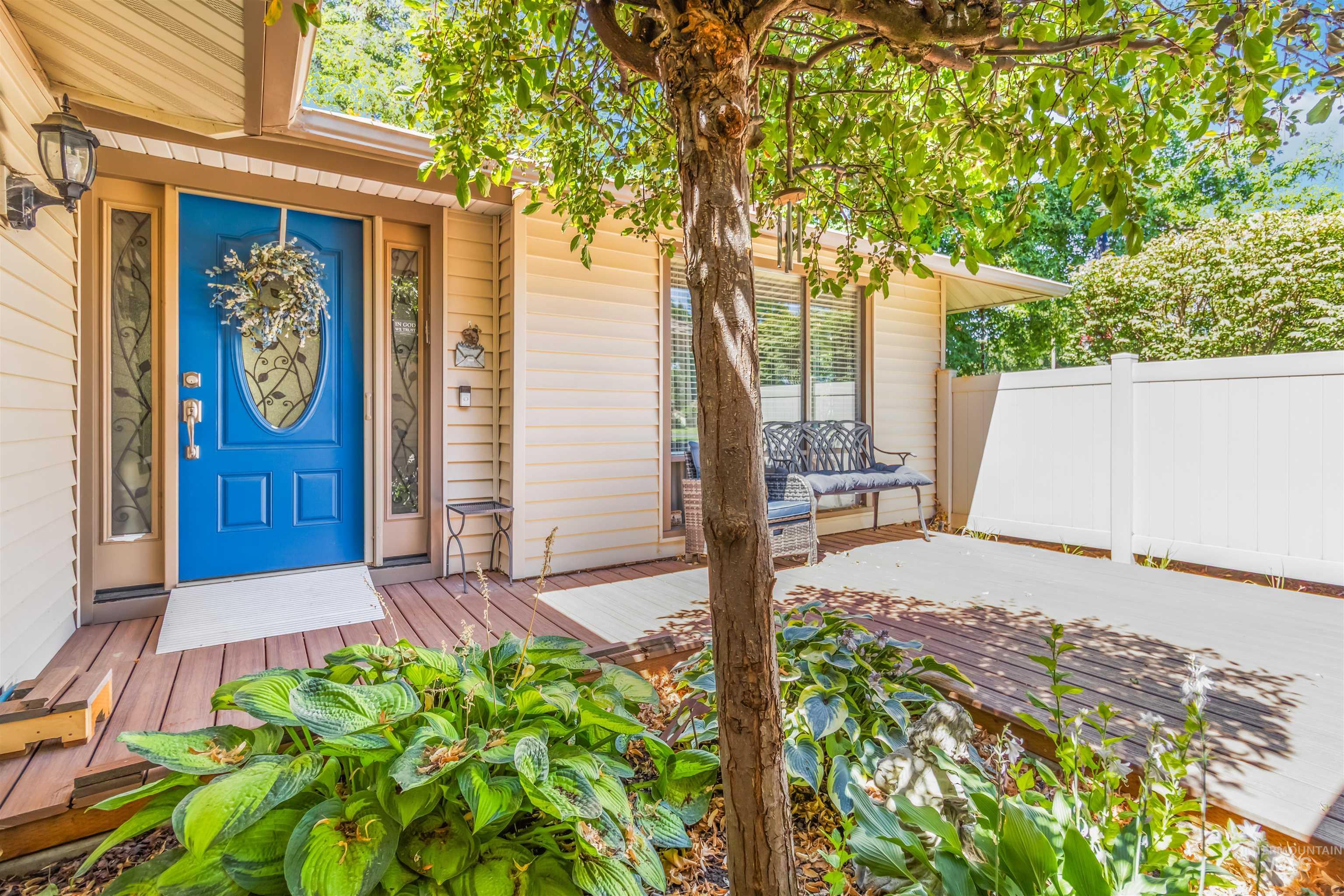 Doorway to property featuring a wooden deck