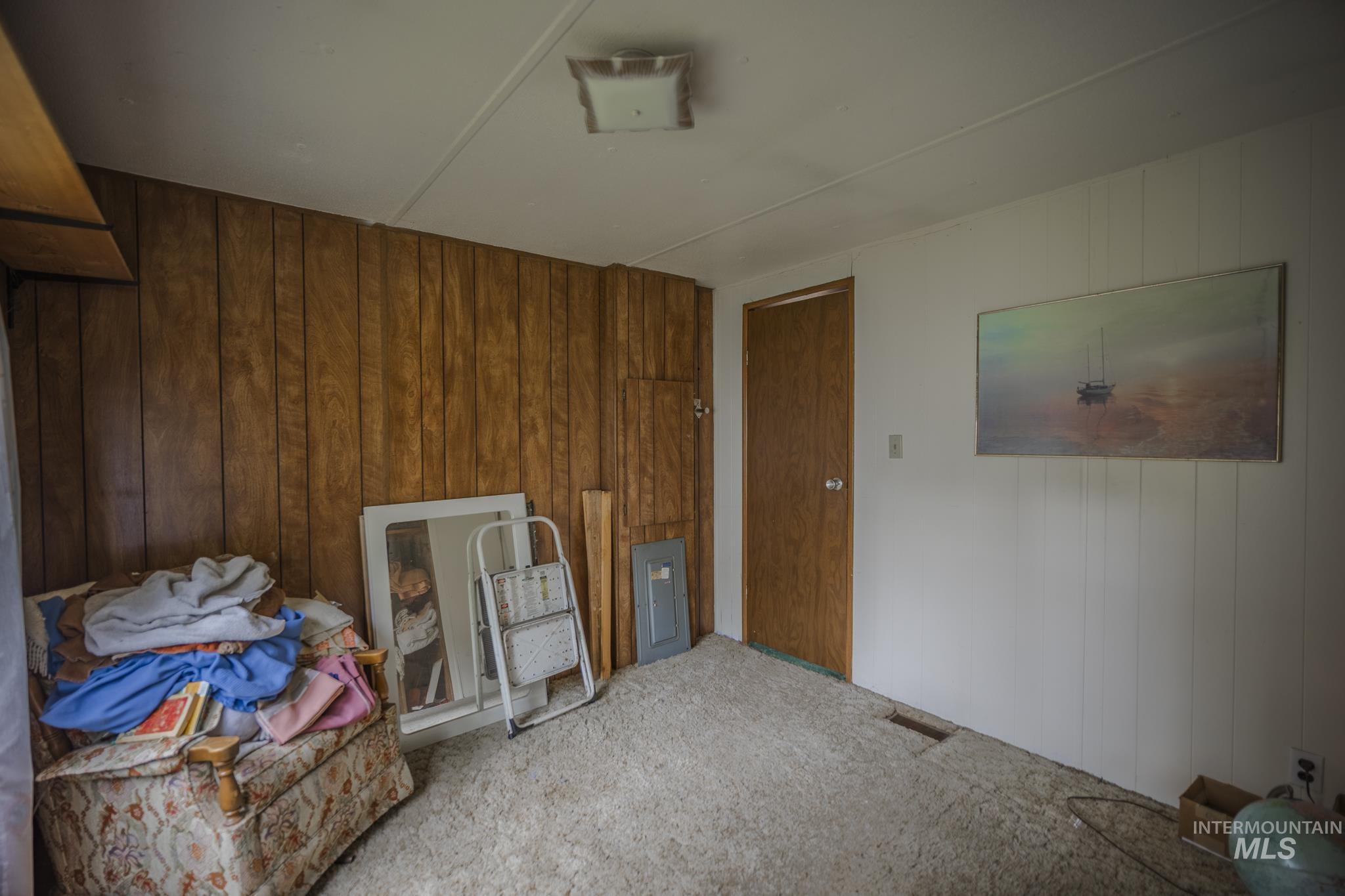 Interior space with wood walls and carpet
