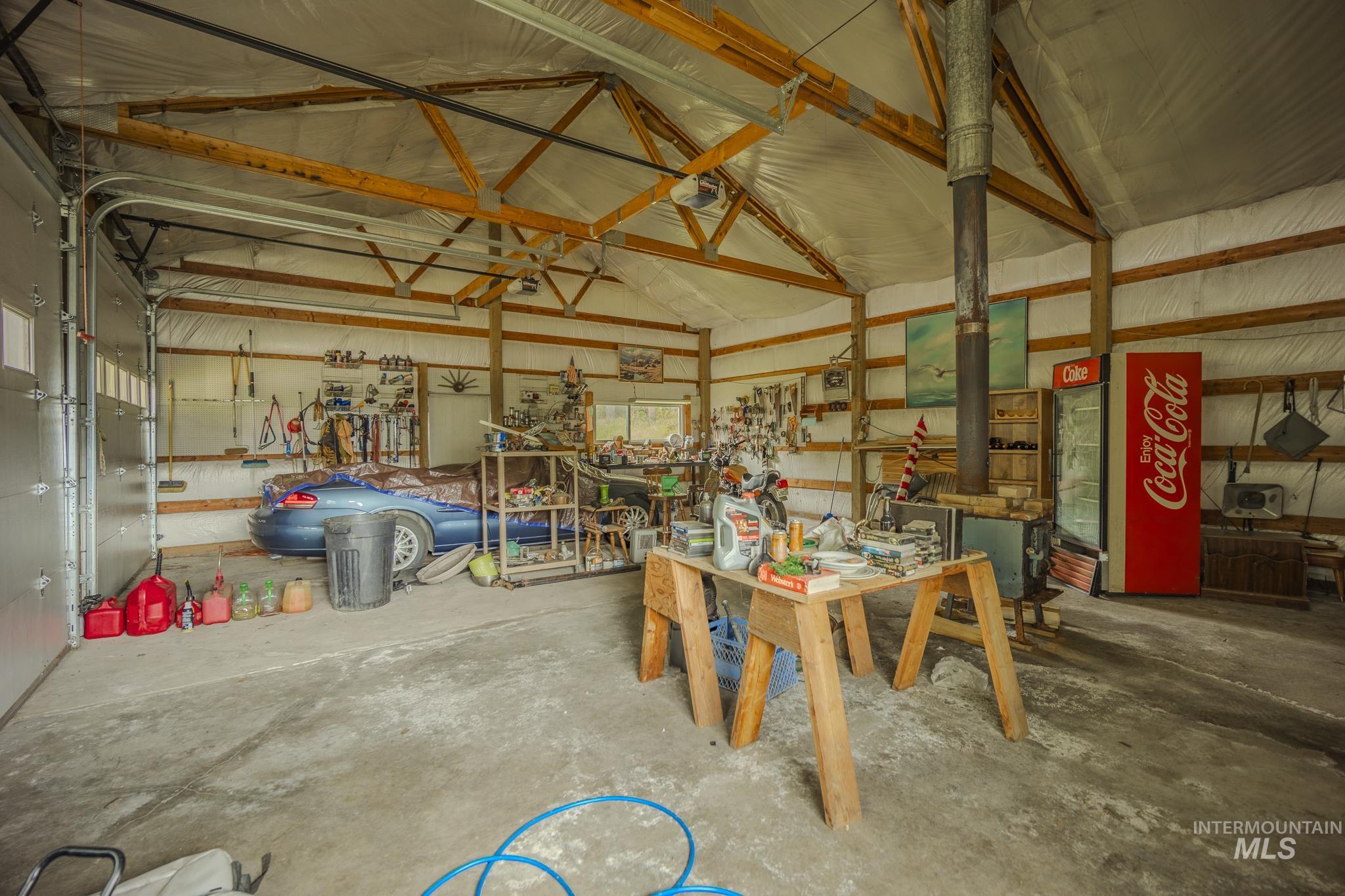 Garage with metal wall and a workshop area
