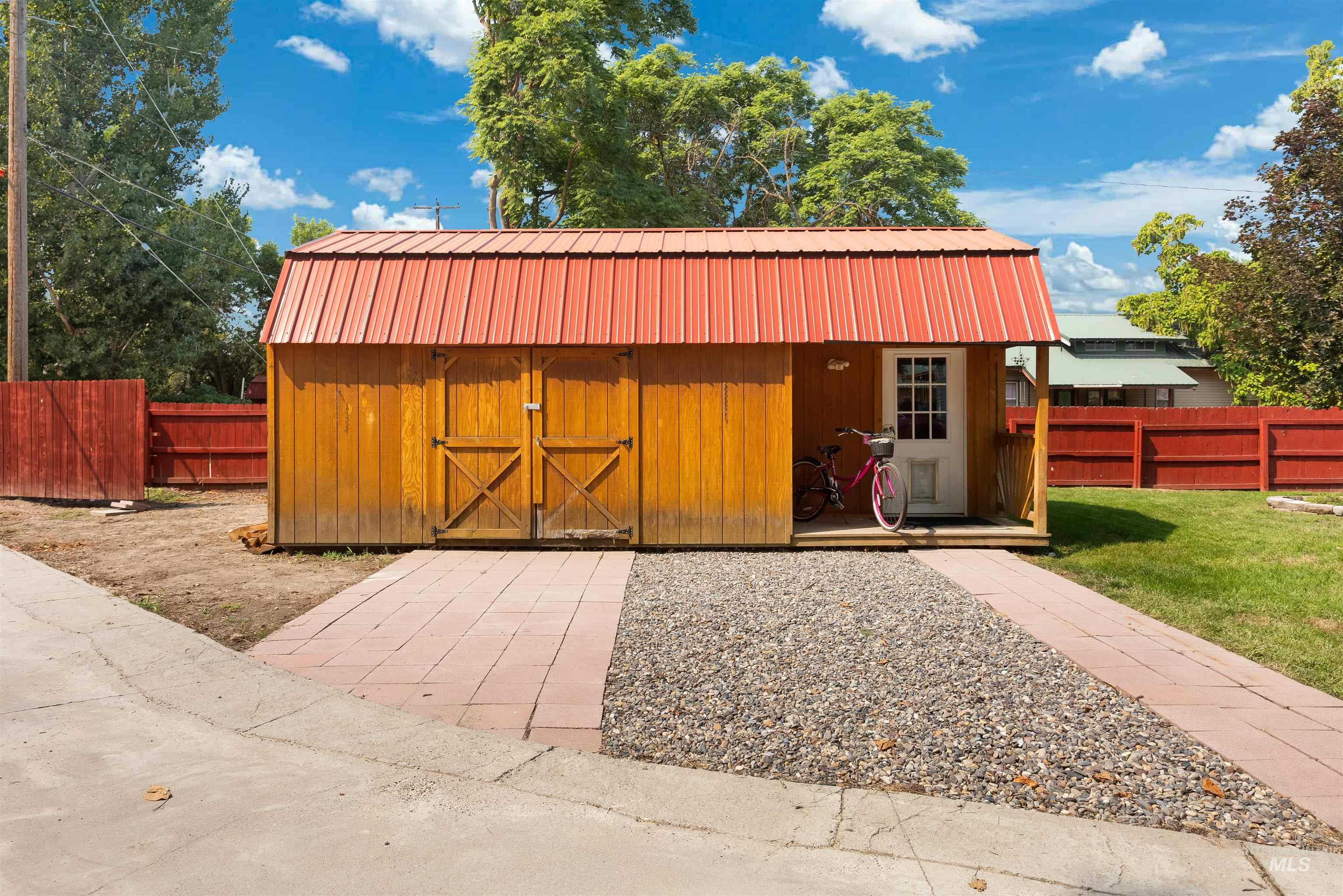 View of outdoor structure featuring a fenced backyard