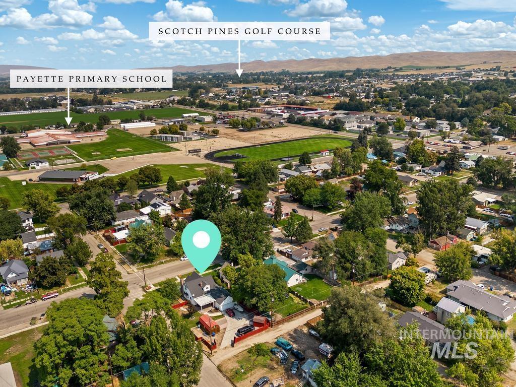 Aerial view of residential area featuring a mountain backdrop
