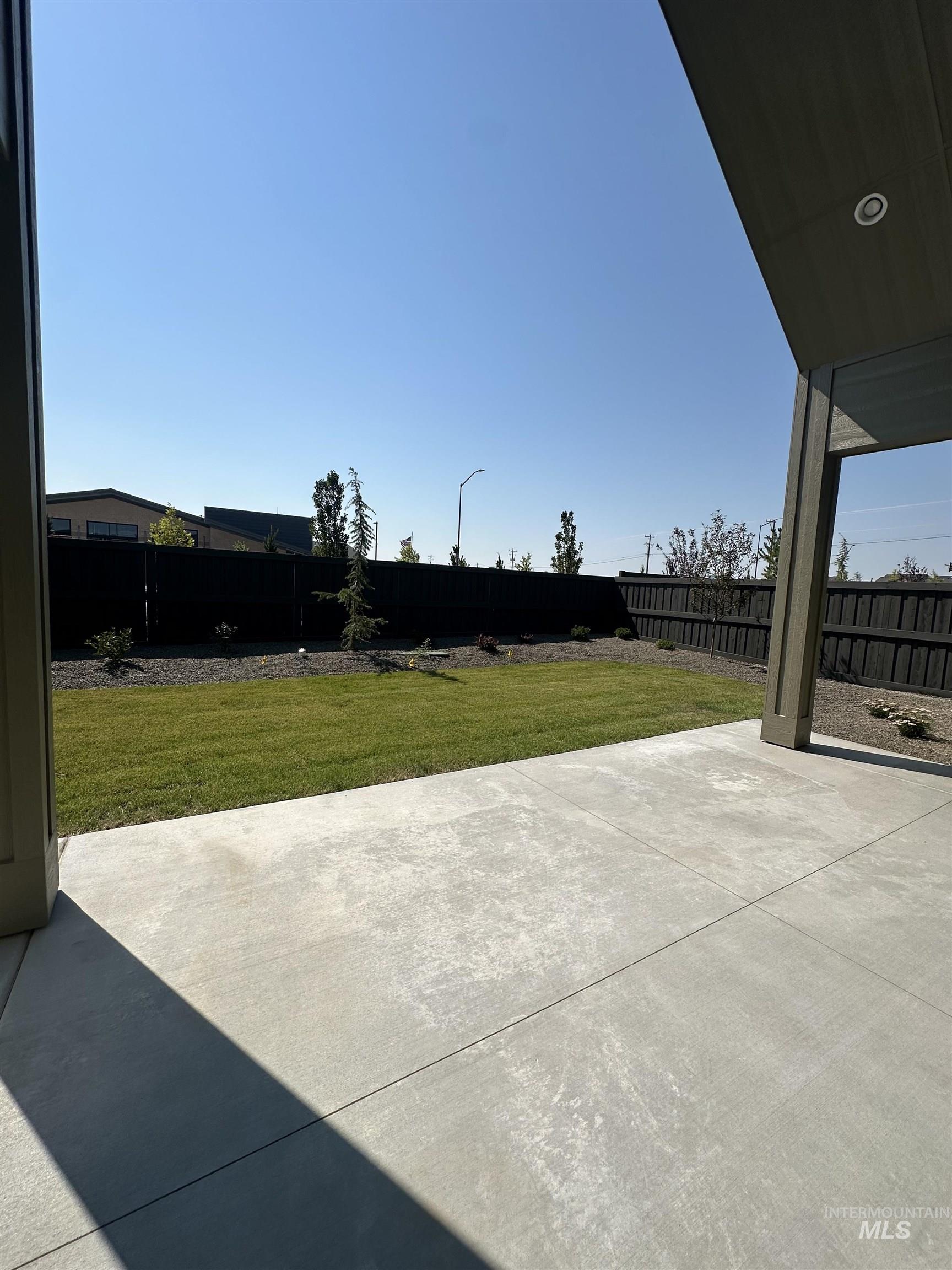 Fenced backyard featuring a patio area