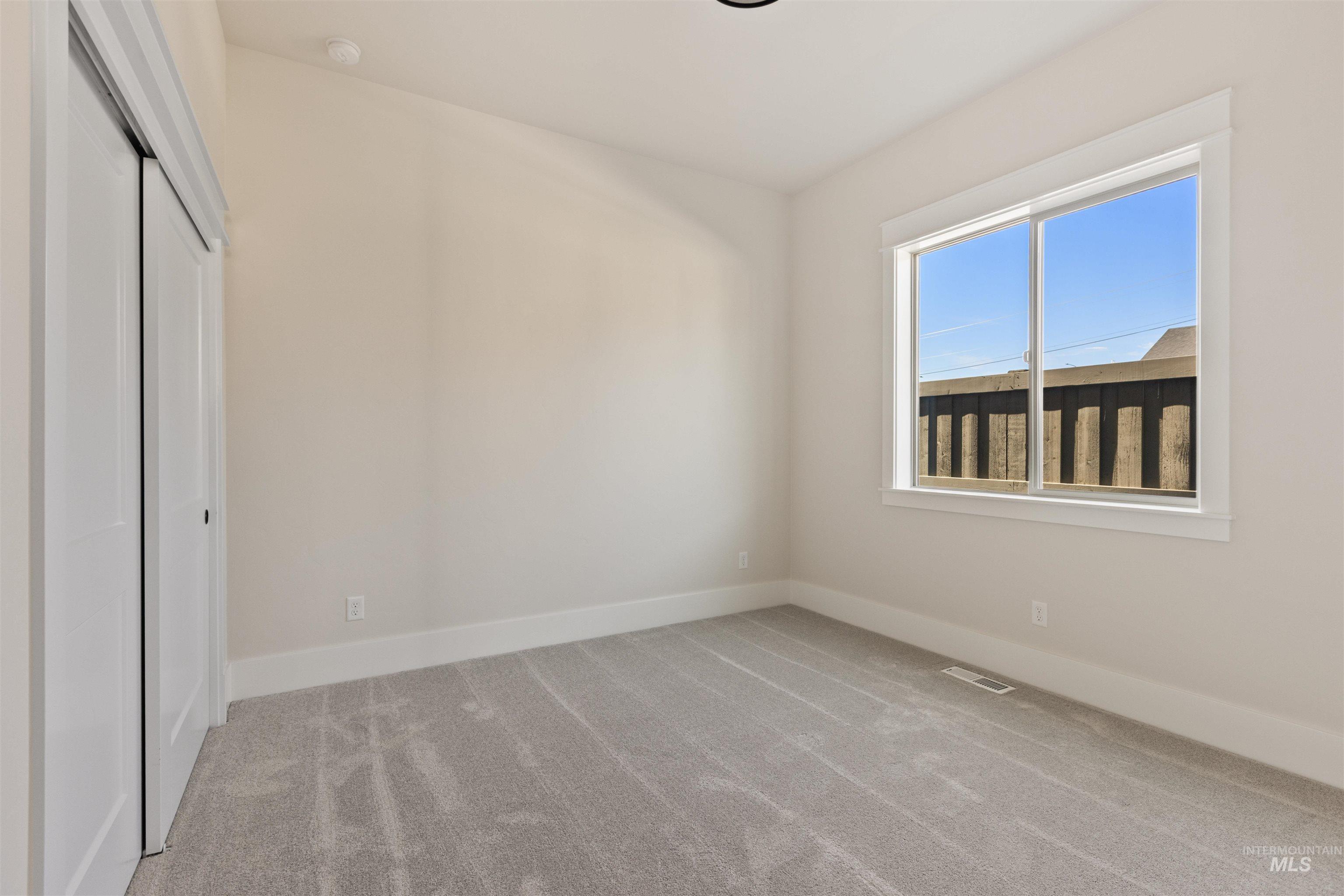 Unfurnished bedroom with carpet floors and a closet