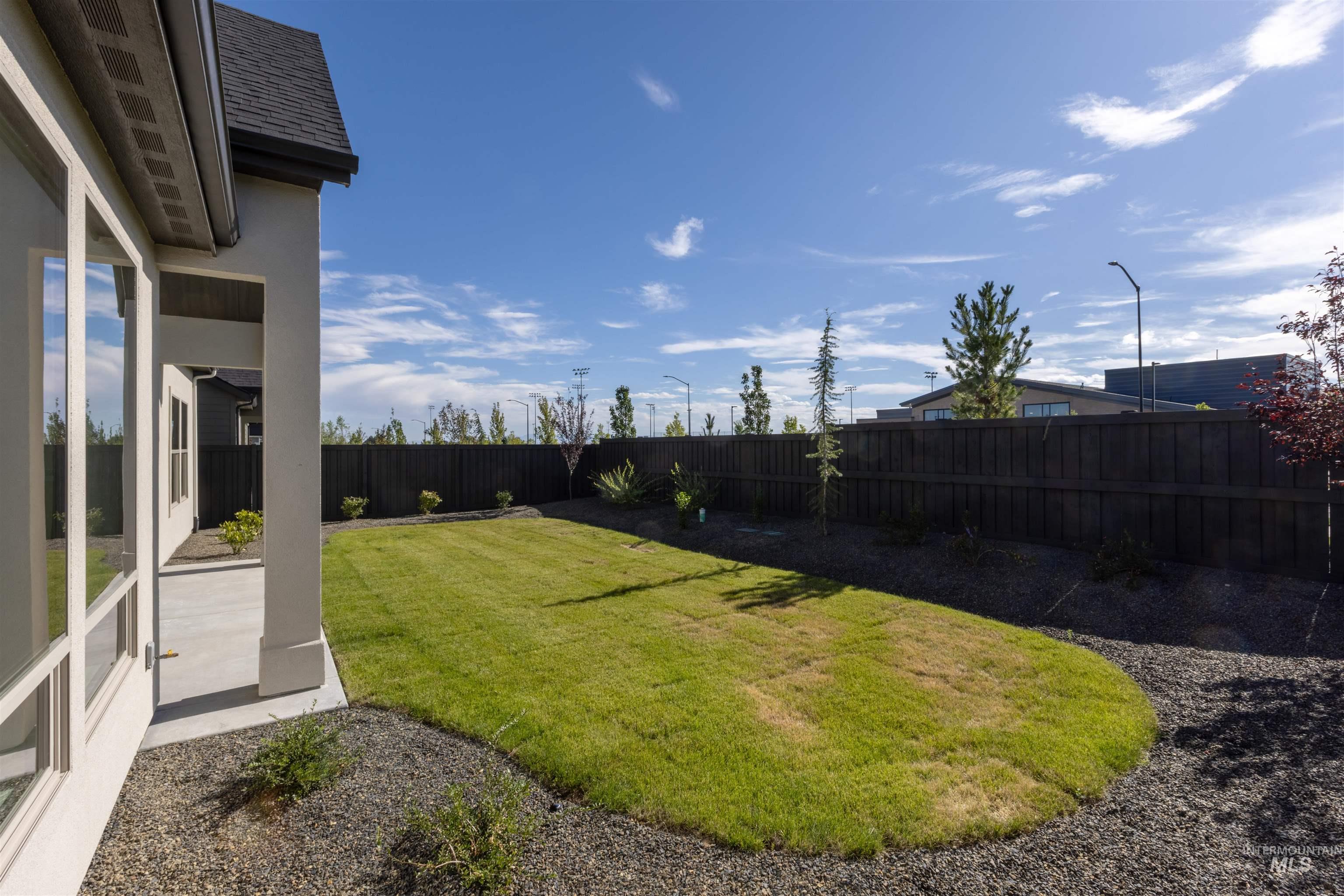 View of fenced backyard