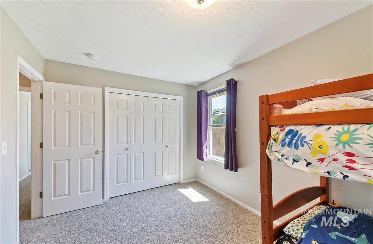 Bedroom with carpet flooring and a closet