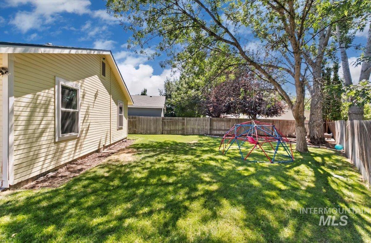 View of fenced backyard