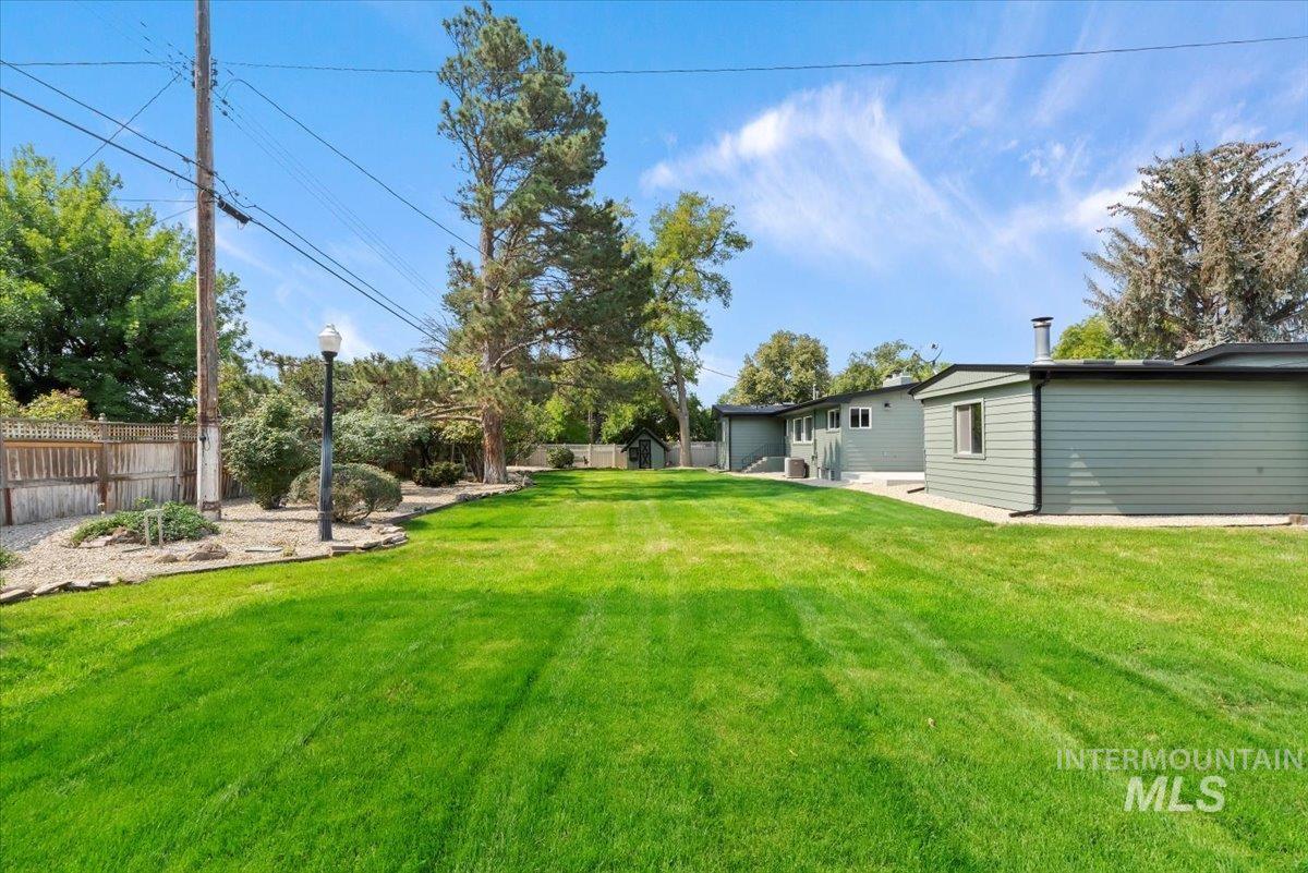 Fenced backyard with a patio