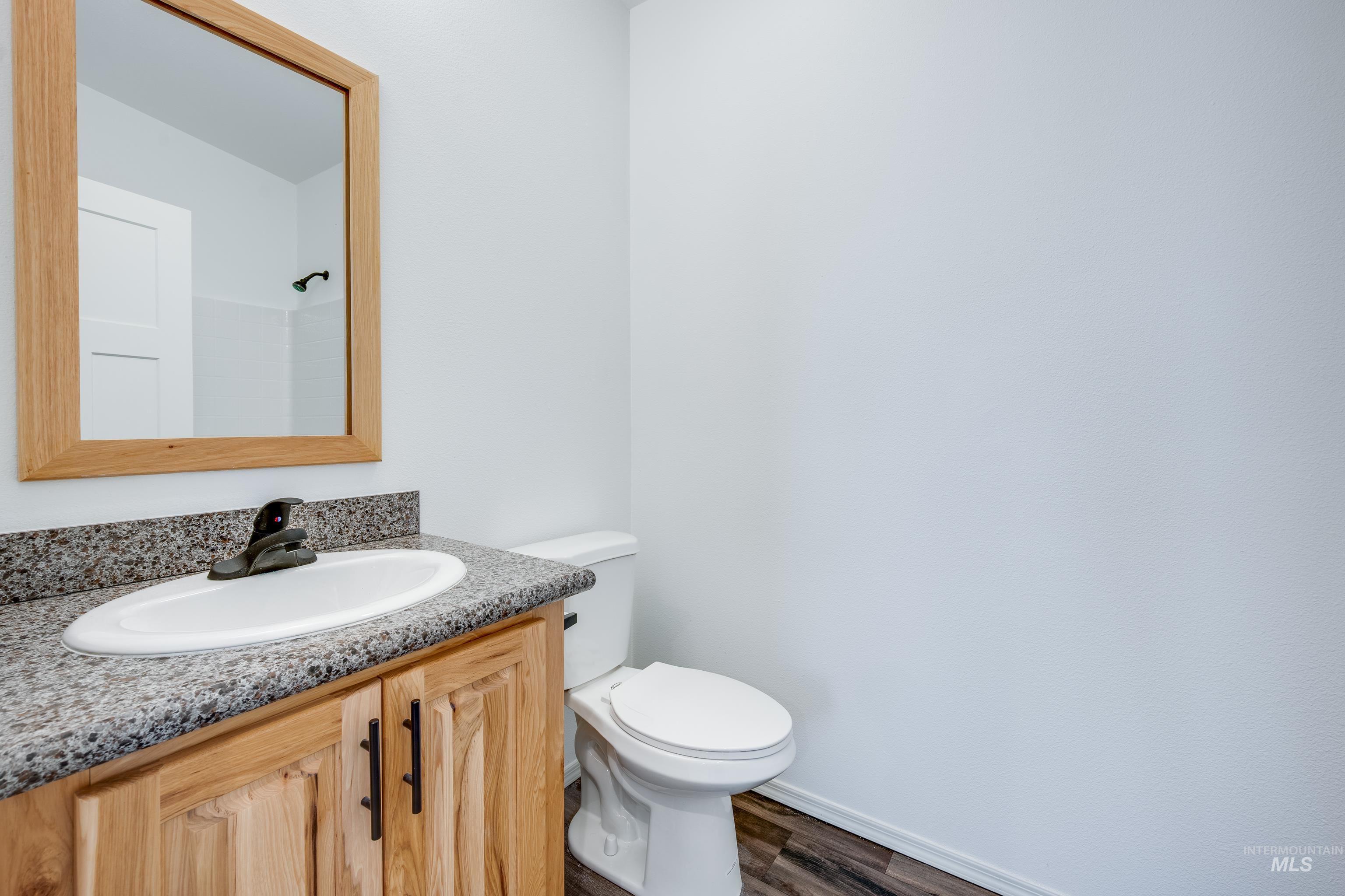 Bathroom with vanity and dark wood finished floors