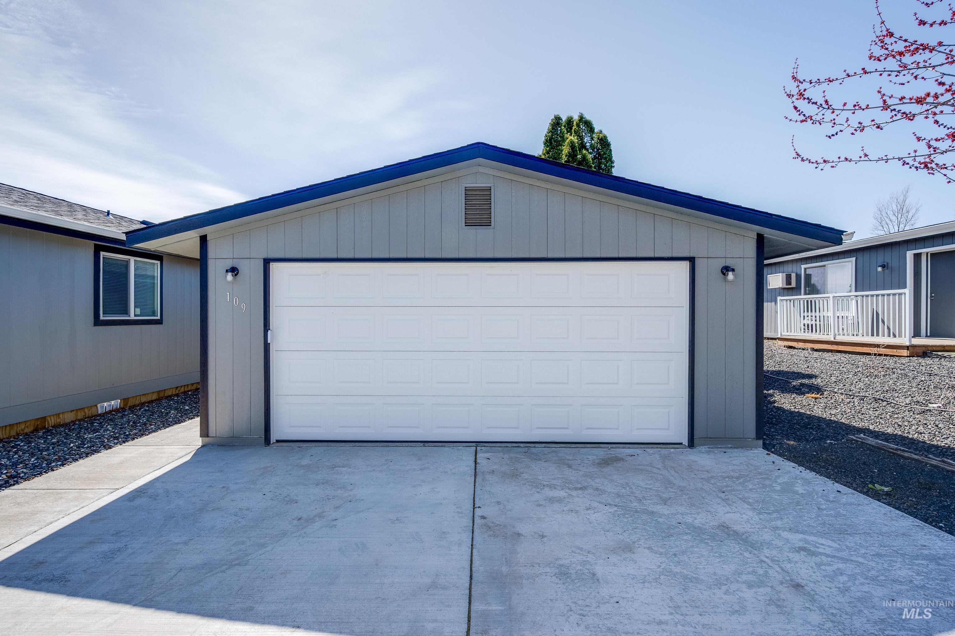 Garage featuring driveway