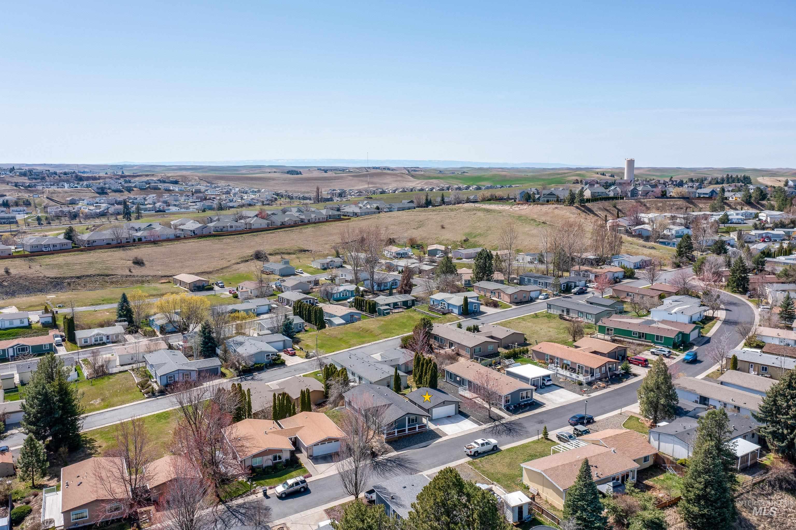 View of property location with nearby suburban area