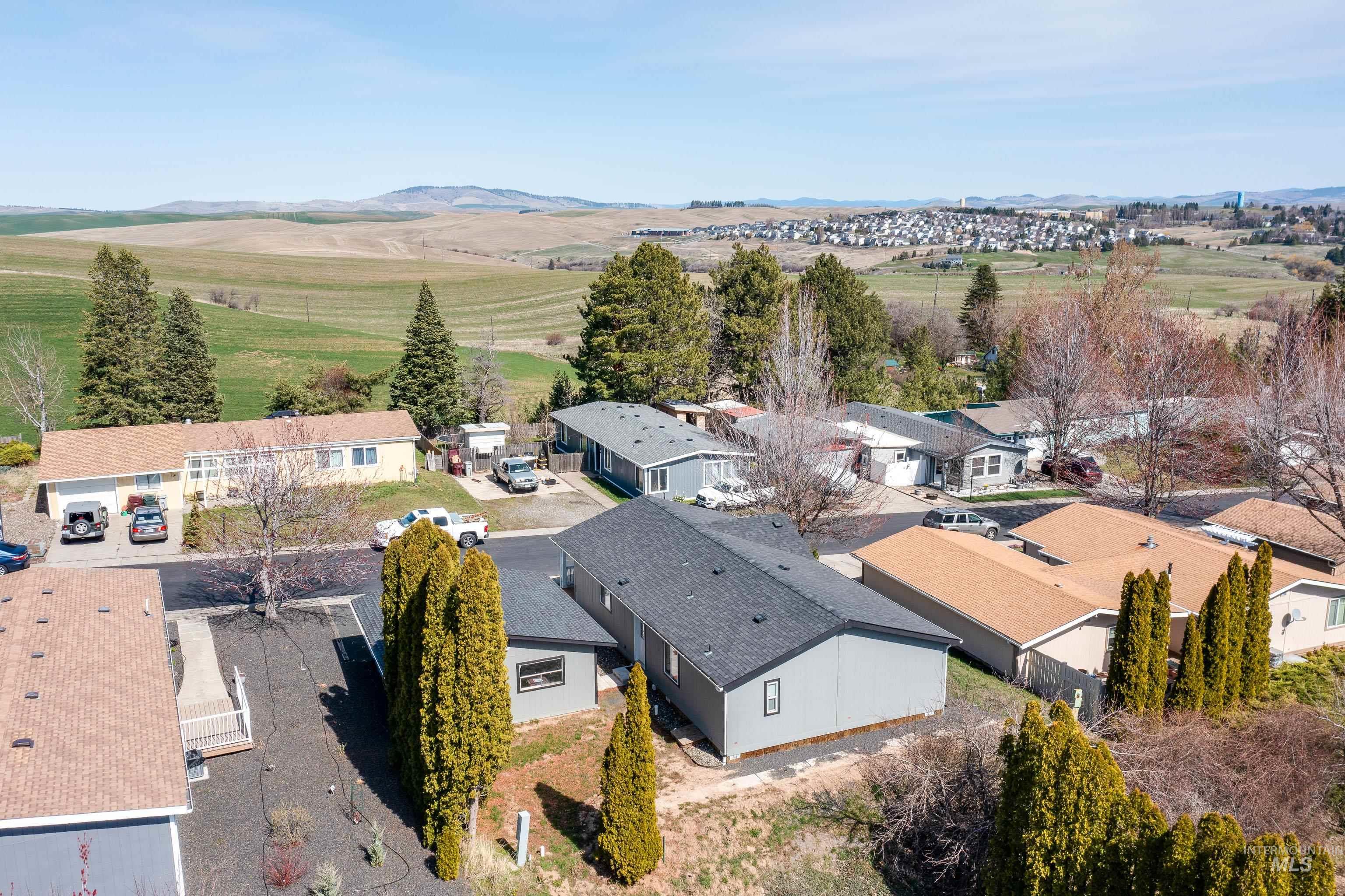 View of rural area with mountains and nearby suburban area