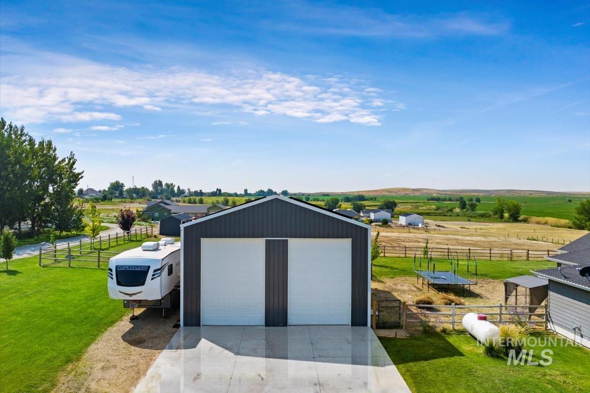 View of outbuilding featuring a rural view