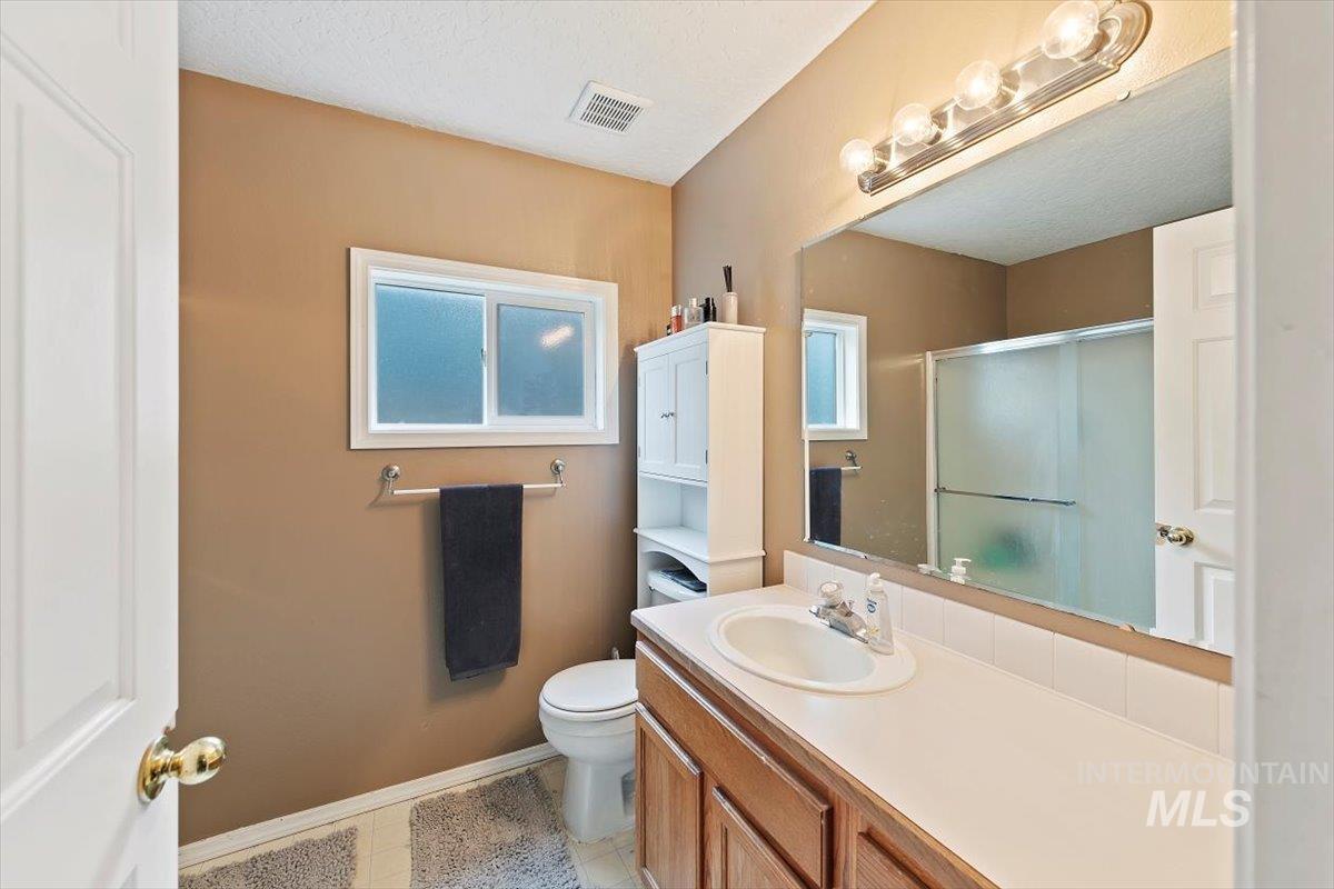 Bathroom featuring a walk in shower stall