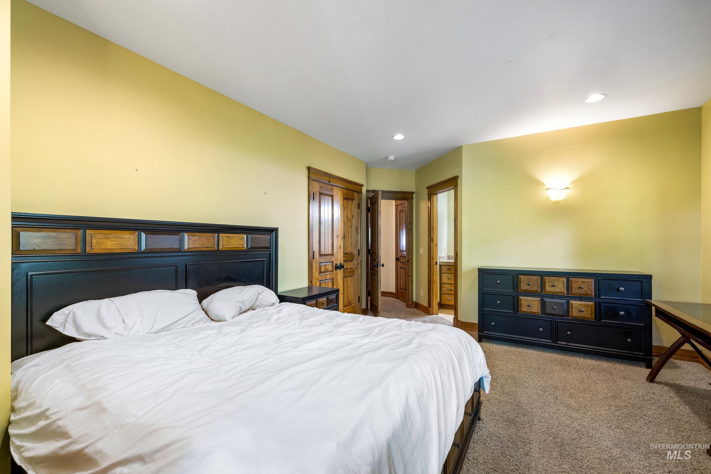 Bedroom with carpet floors and recessed lighting