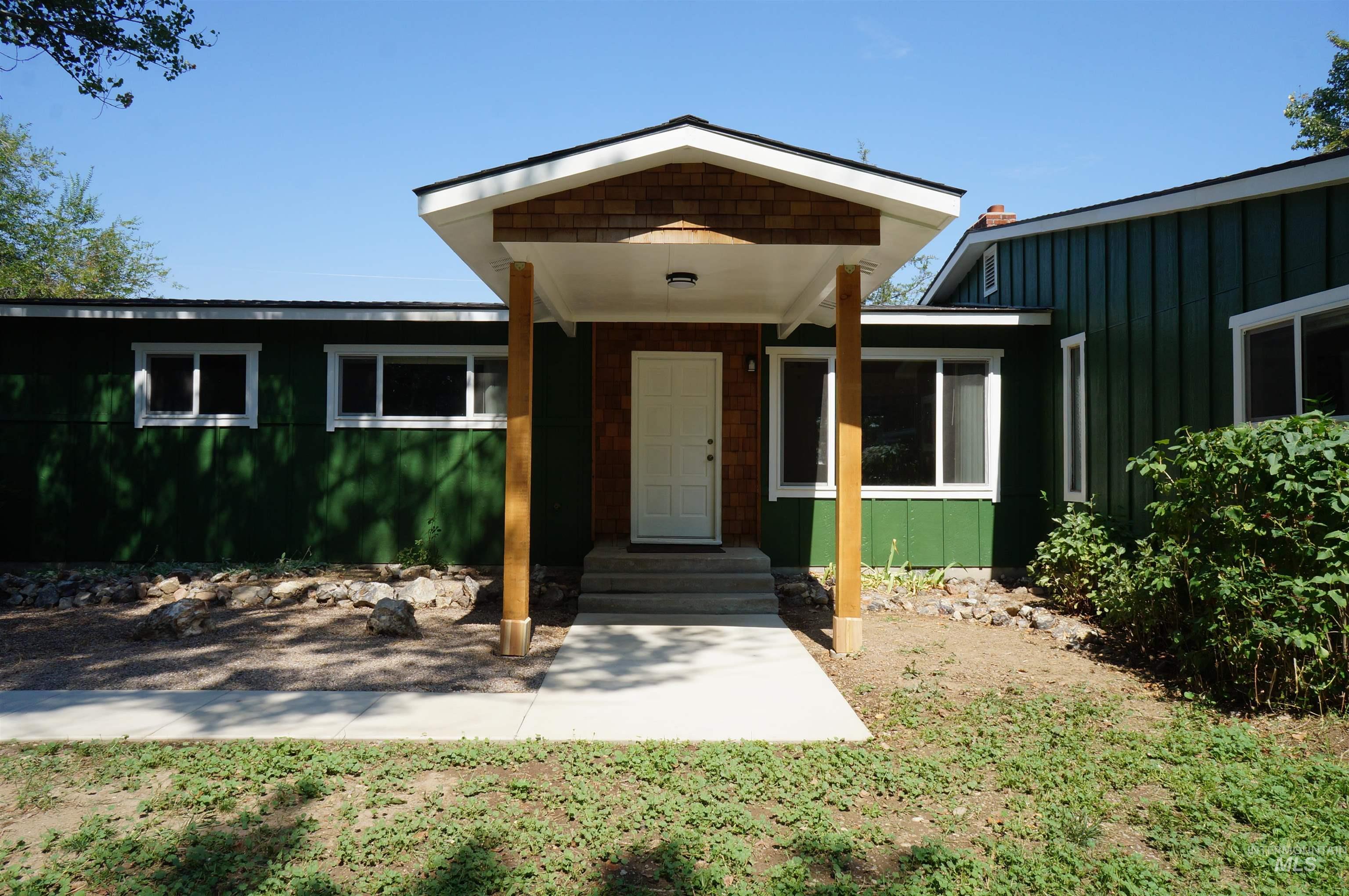 View of front of home with board and batten siding