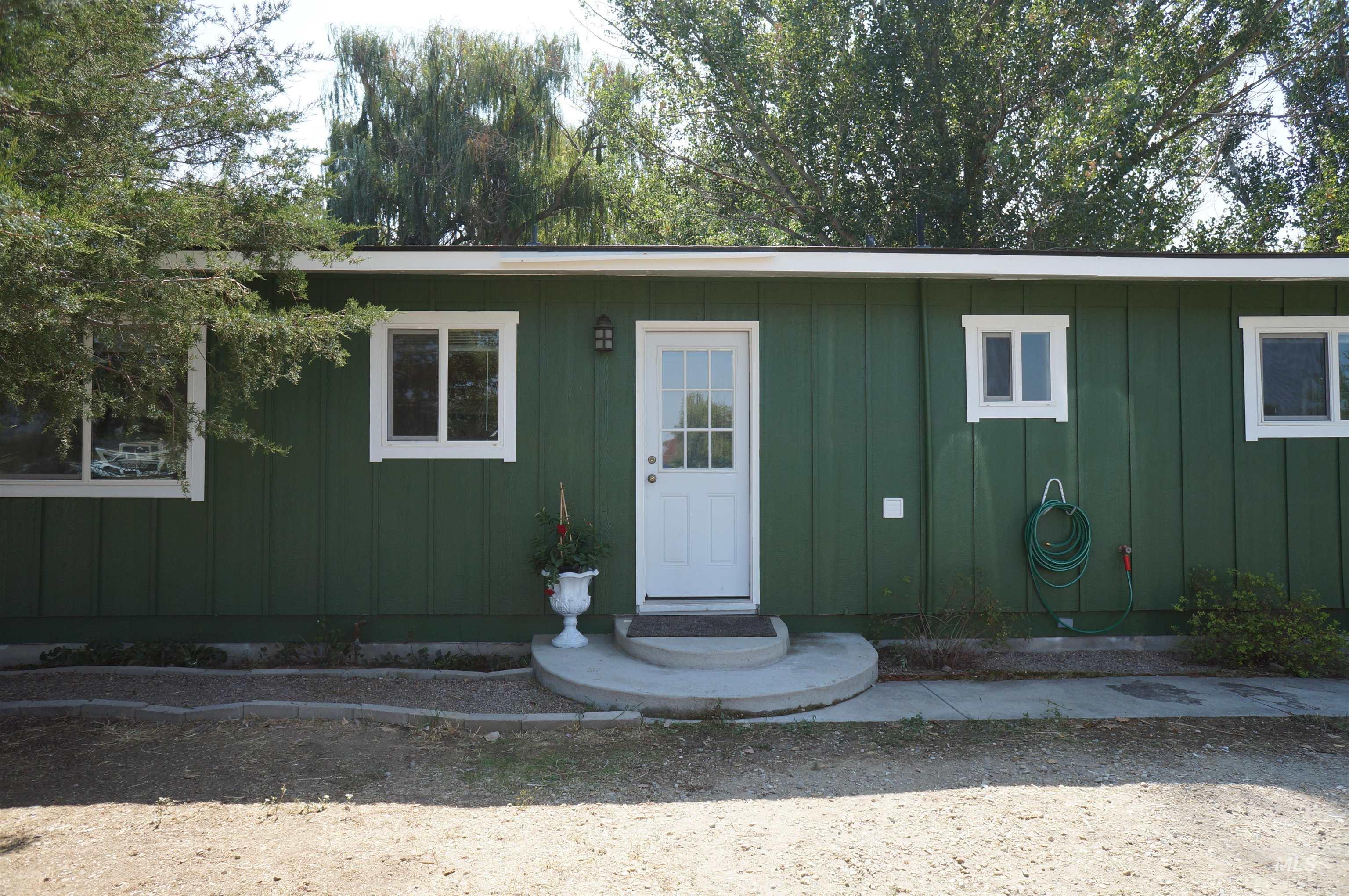 Entrance to property with board and batten siding