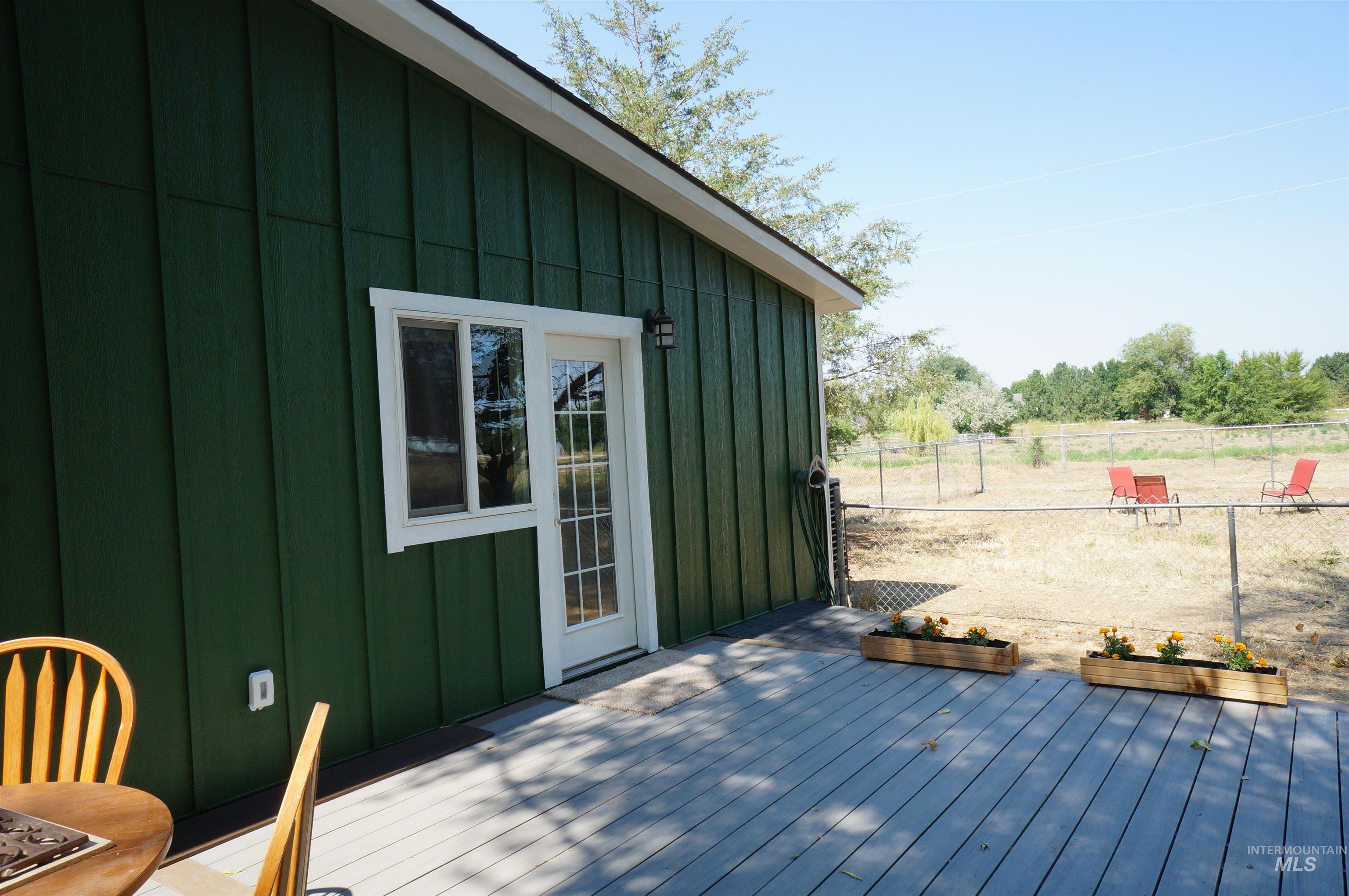 Deck with view of wooded area
