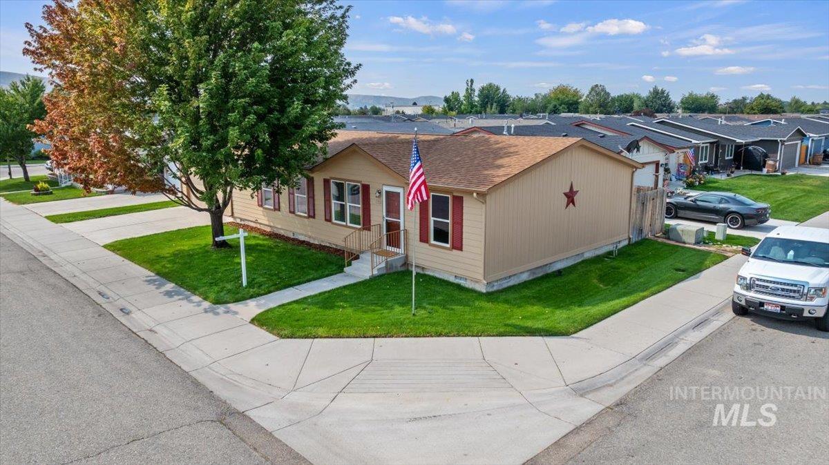 View of front of house with a front lawn and a residential view