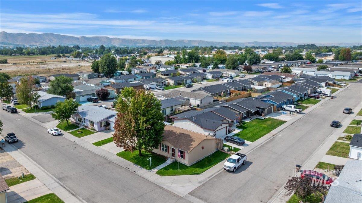 Aerial view of residential area with a mountainous background