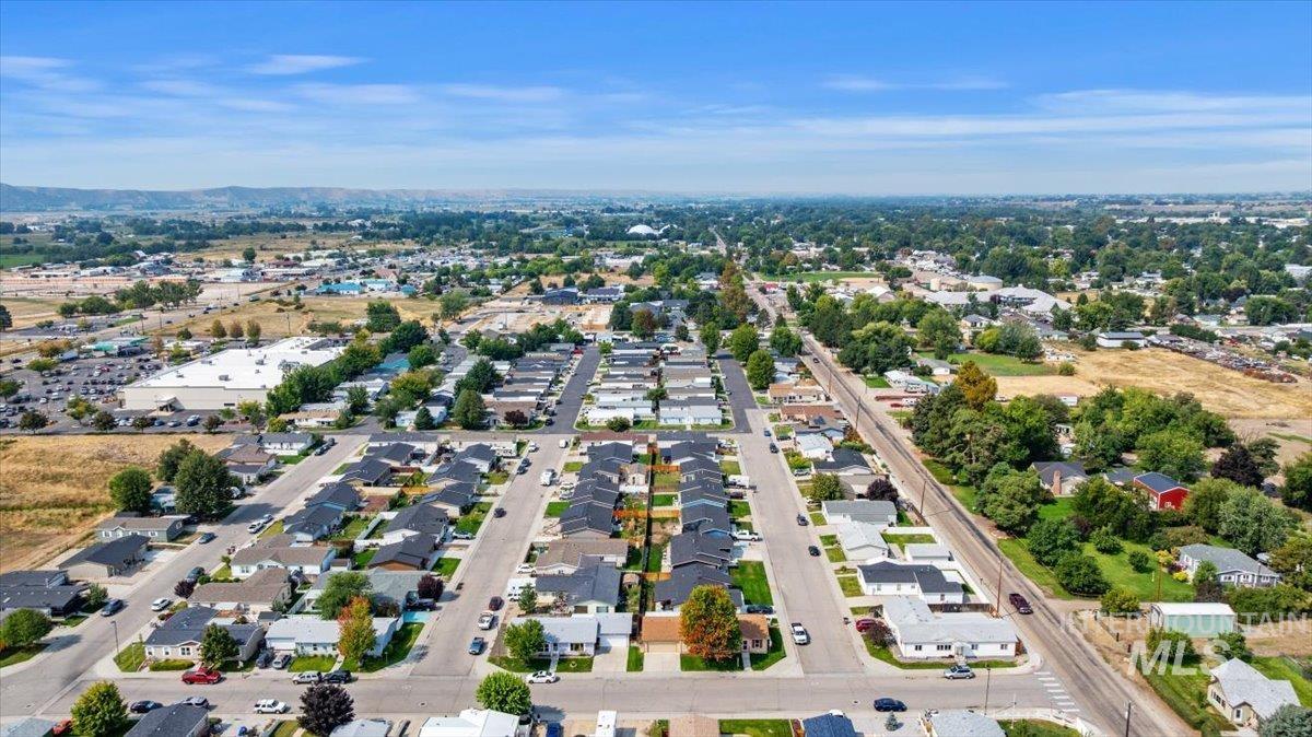Aerial overview of property's location with nearby suburban area