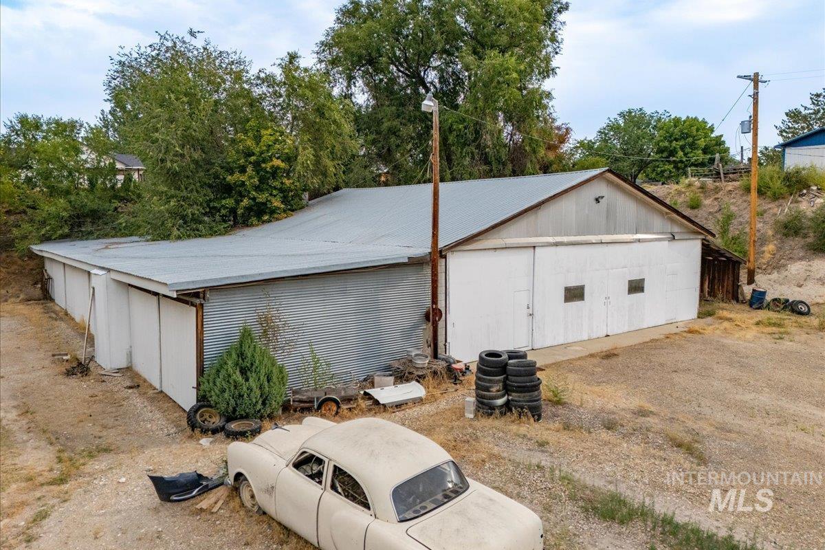View of side of home with an outdoor structure and a pole building