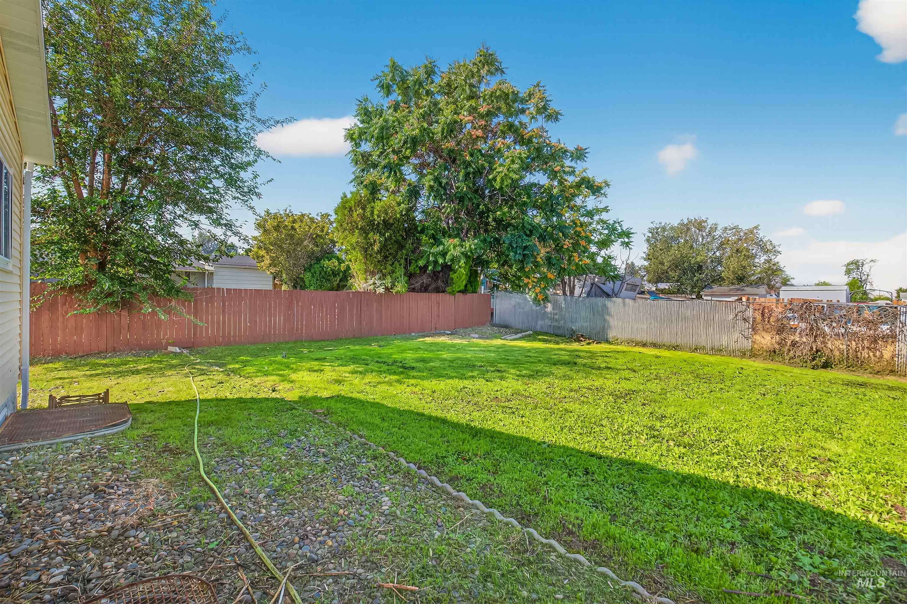 View of fenced backyard