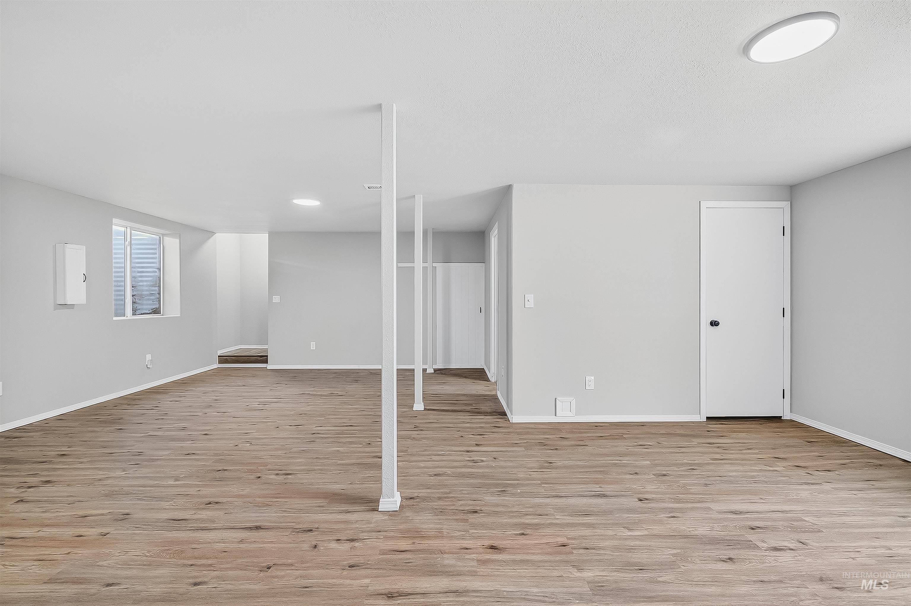 Below grade area featuring light wood-type flooring