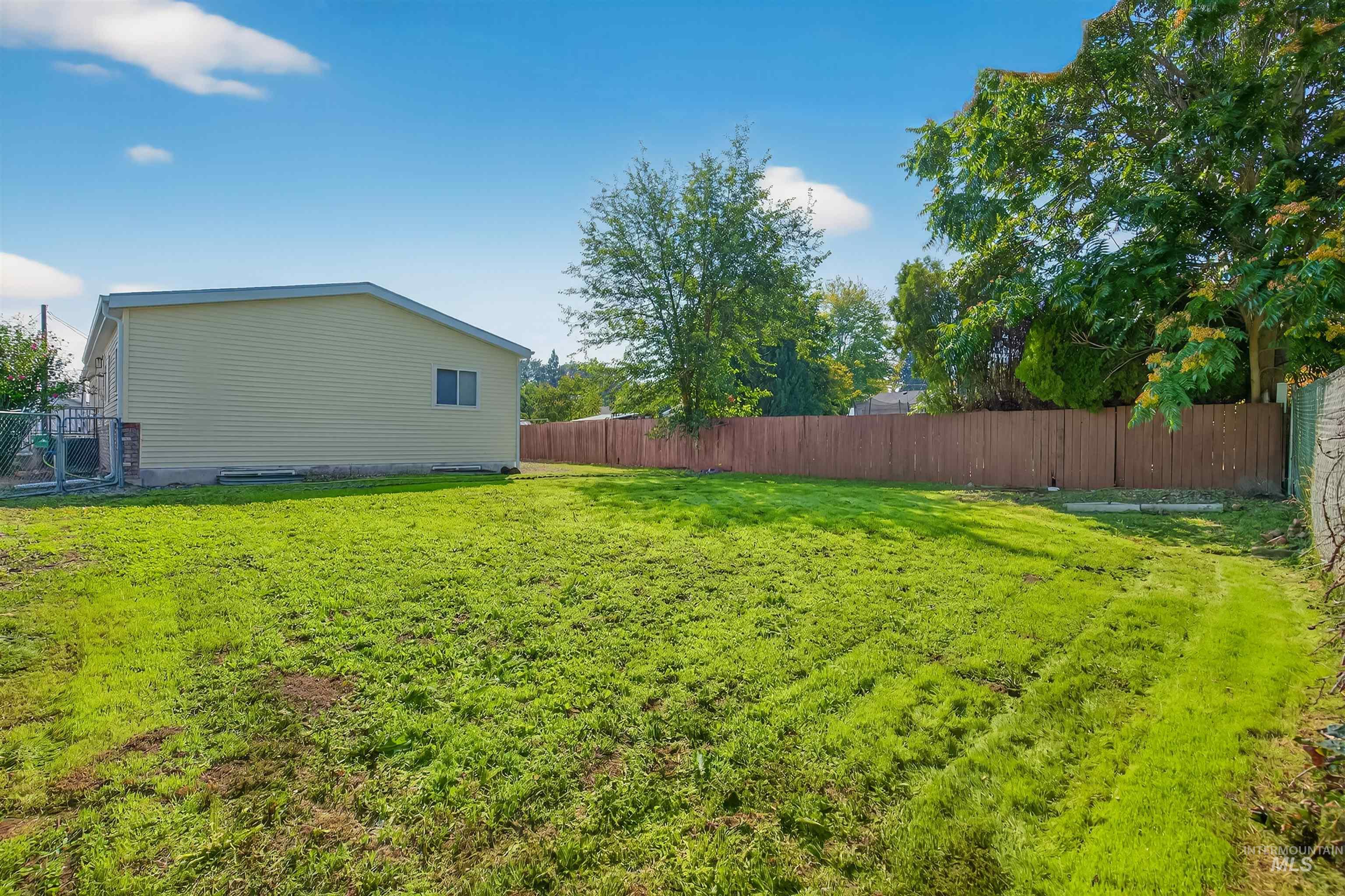 View of fenced backyard