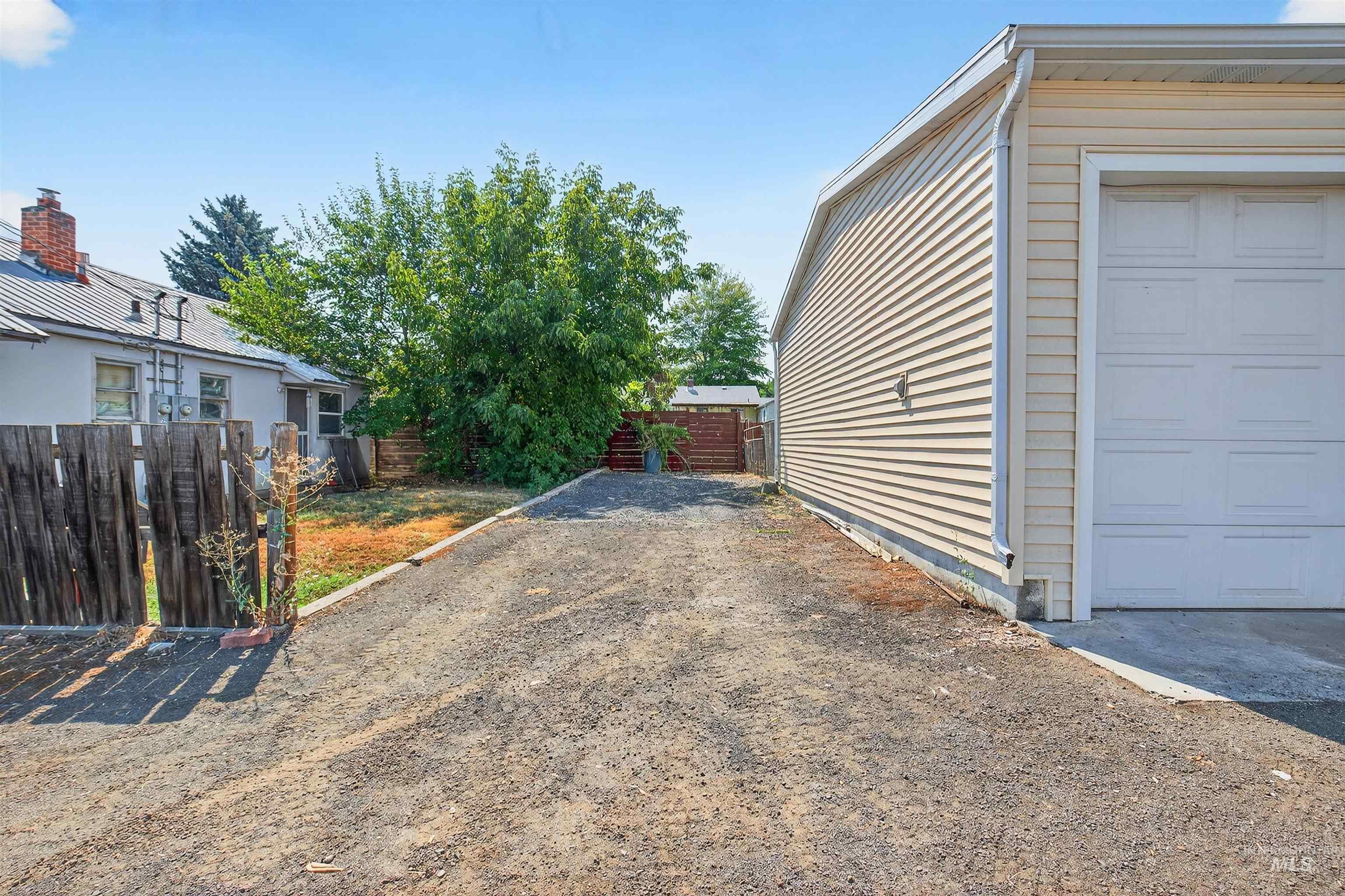View of home's exterior featuring driveway