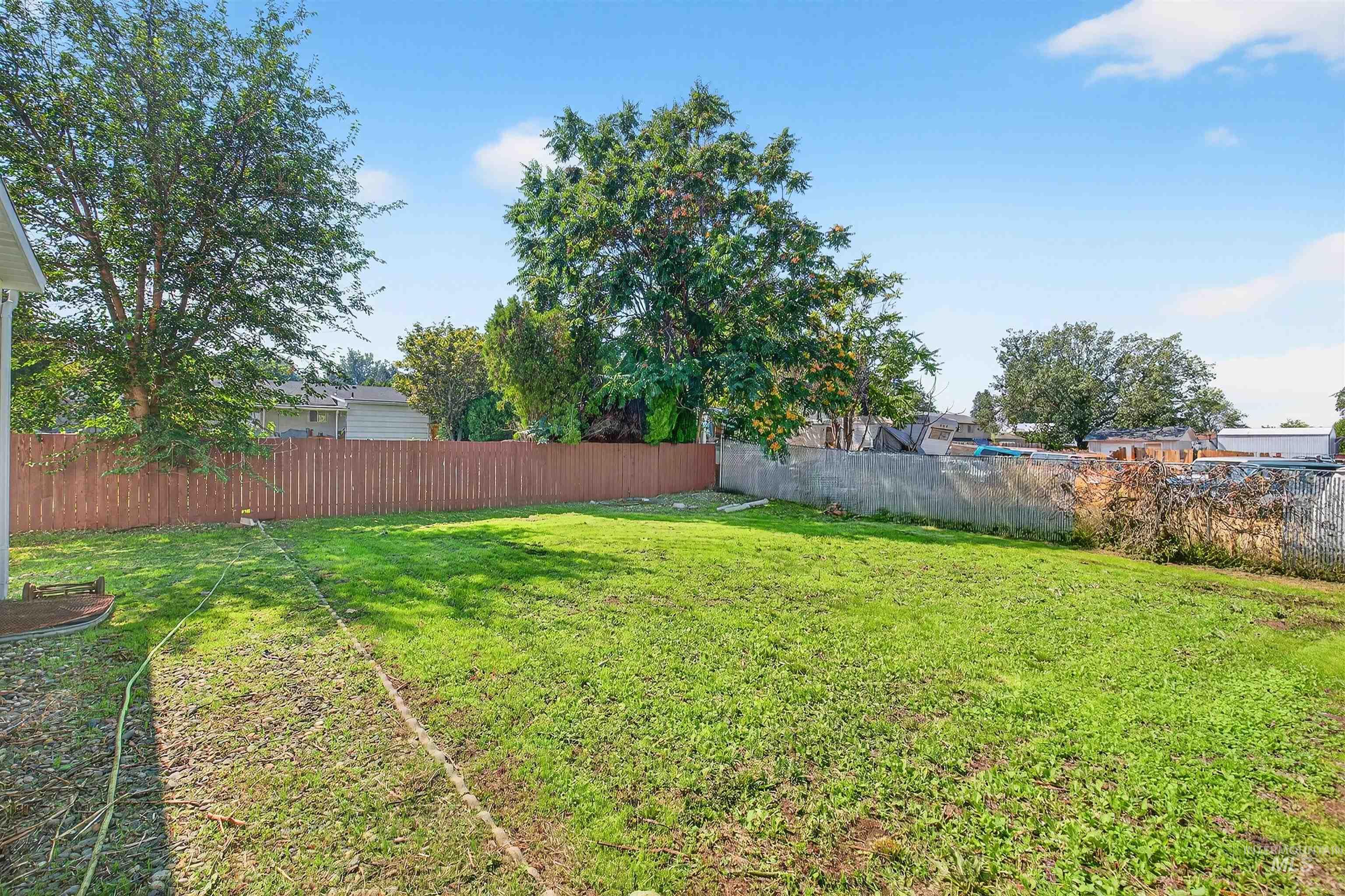 View of fenced backyard