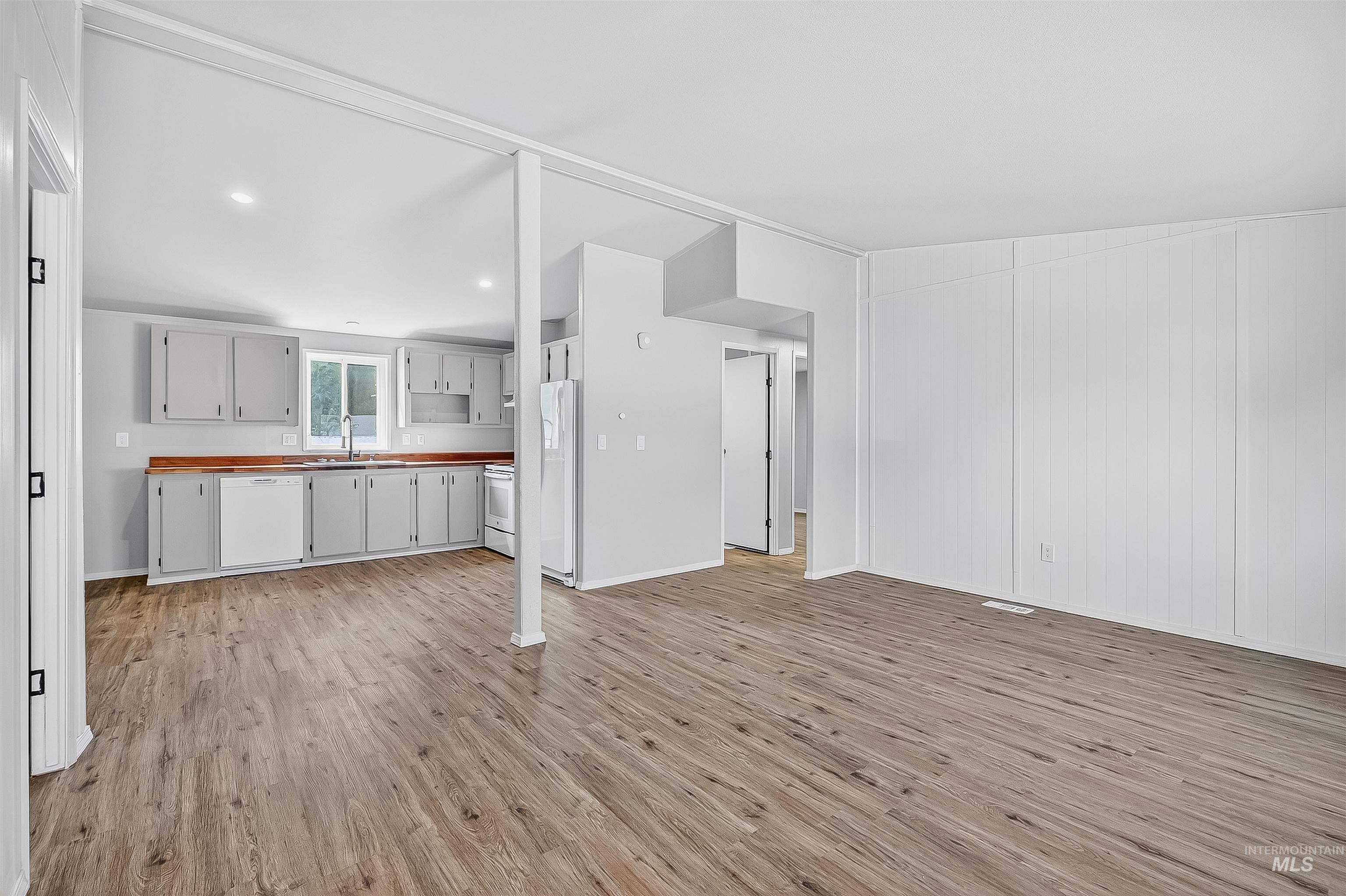 Unfurnished living room with light wood-style floors and recessed lighting