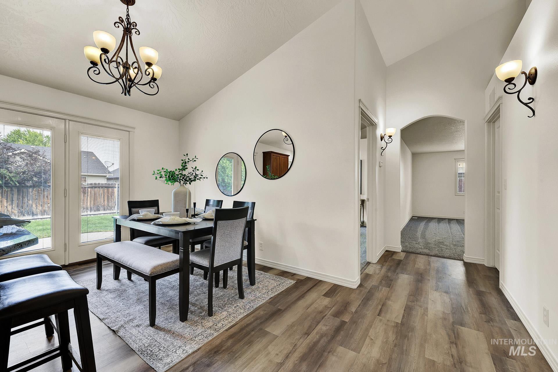 Open concept with access to the kitchen and the living room. Plenty of room for a dining table or sit at the bar. Patio door allows for plenty of natural light.