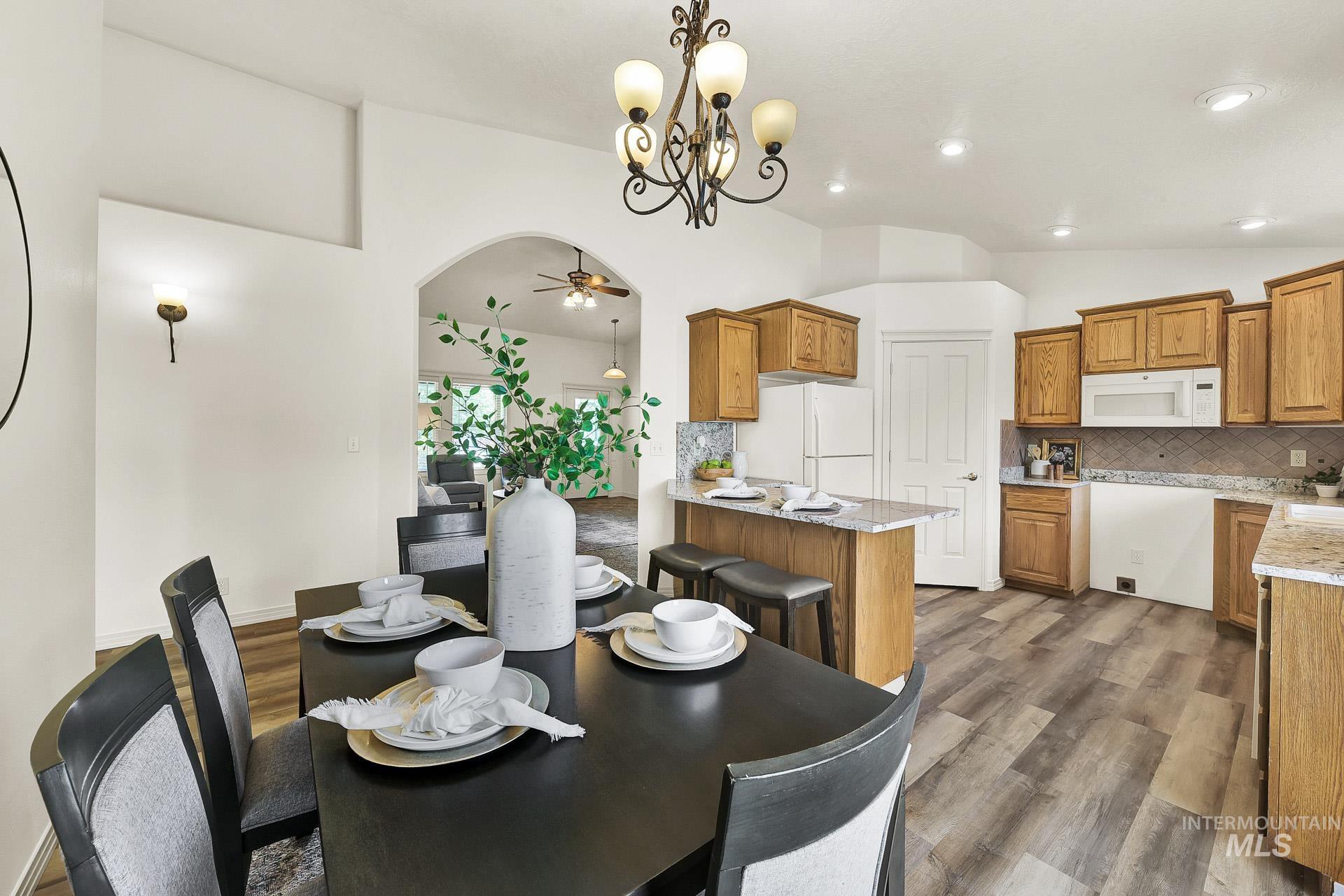 Open concept with access to the kitchen and the living room. Plenty of room for a dining table or sit at the bar. Patio door allows for plenty of natural light.