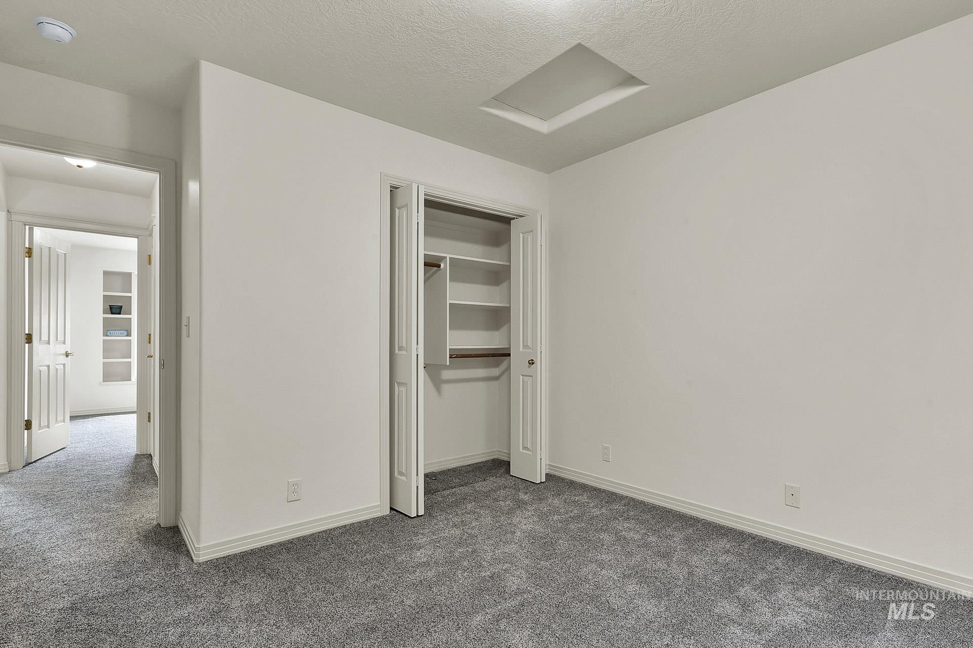 Spacious closet with built in shelving